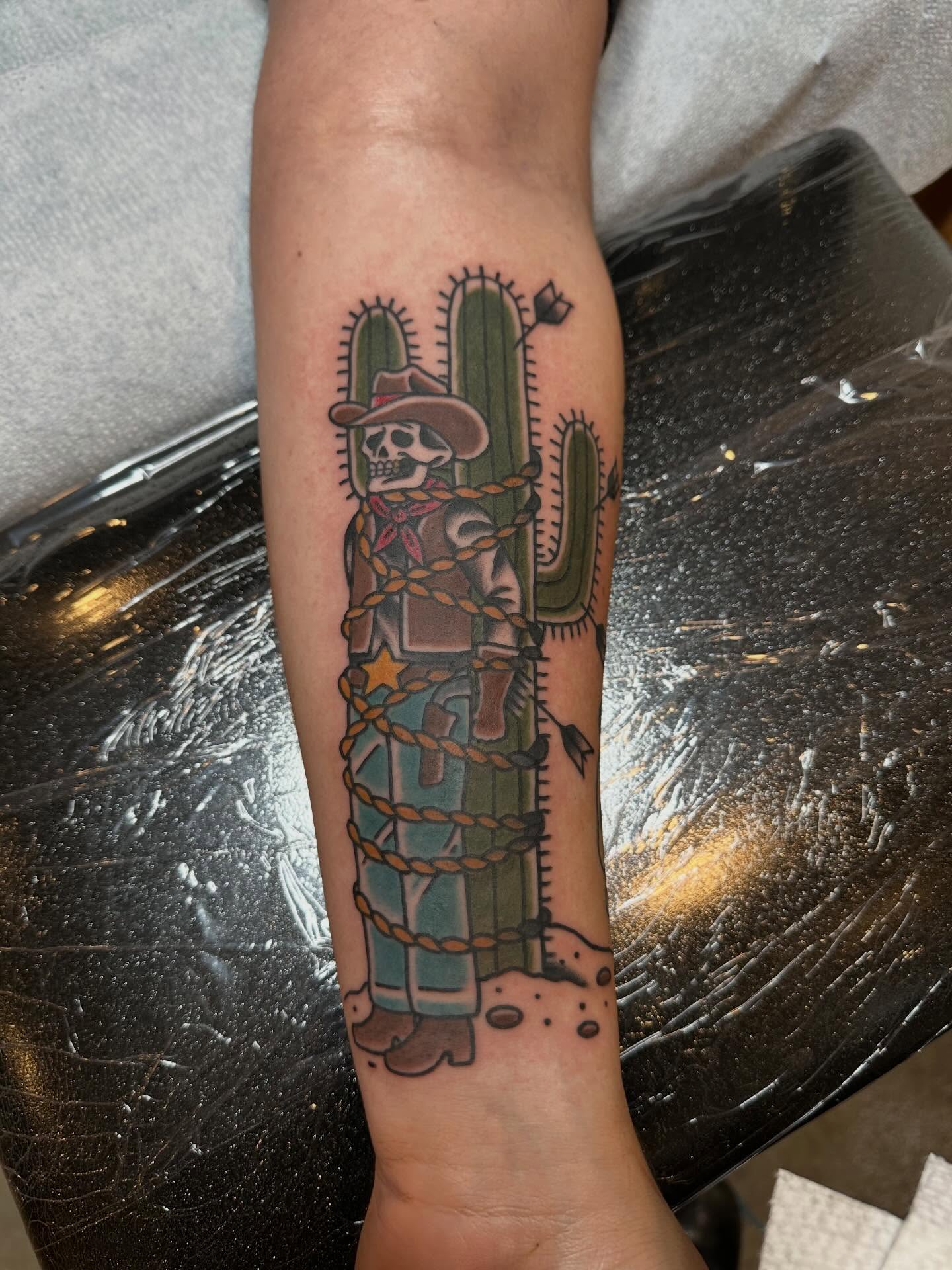 Cowboy skeleton American traditional tattoo on the forearm by Whitney Creep Tattoos