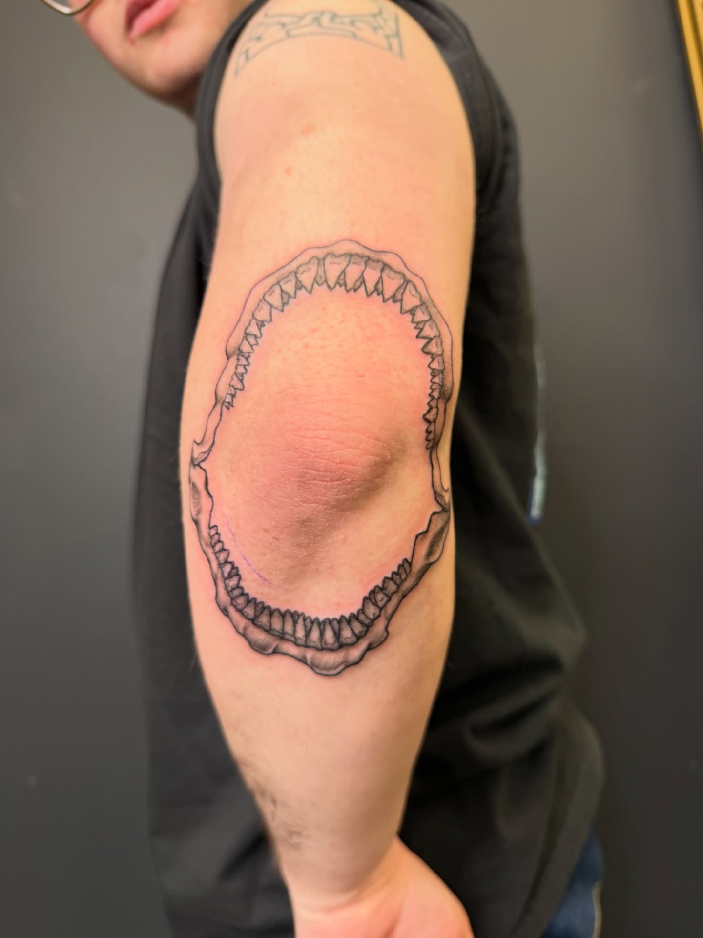 Jaws black and grey tattoo on the forearm by Noah Blum