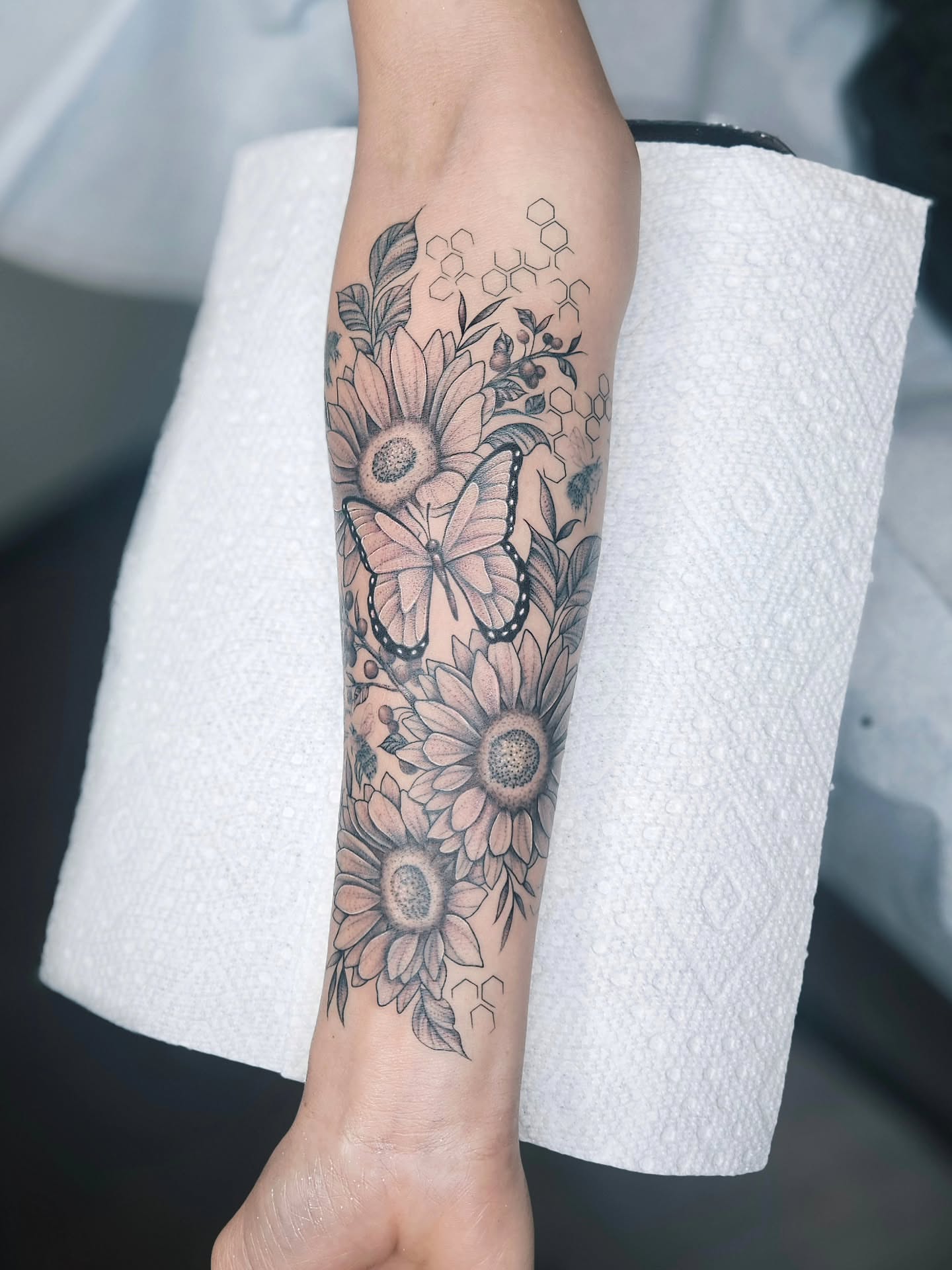 Sunflowers and butterfly black and grey tattoo on the forearm by TaylorLeighShermanTattoos OFFICIAL