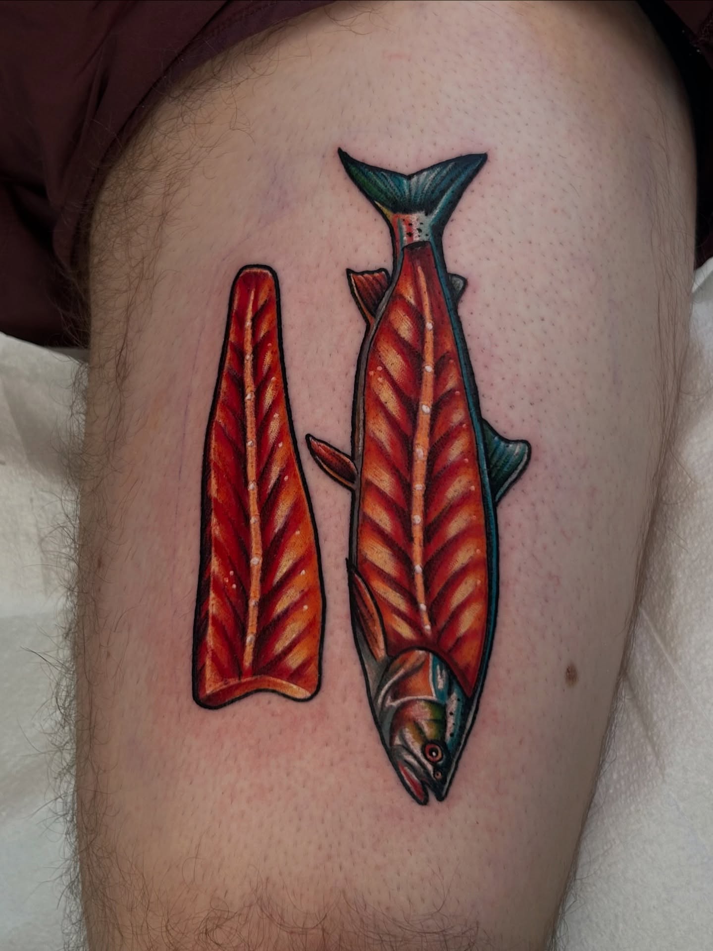 Salmon American traditional tattoo on the thigh by Kim Goff - Special K