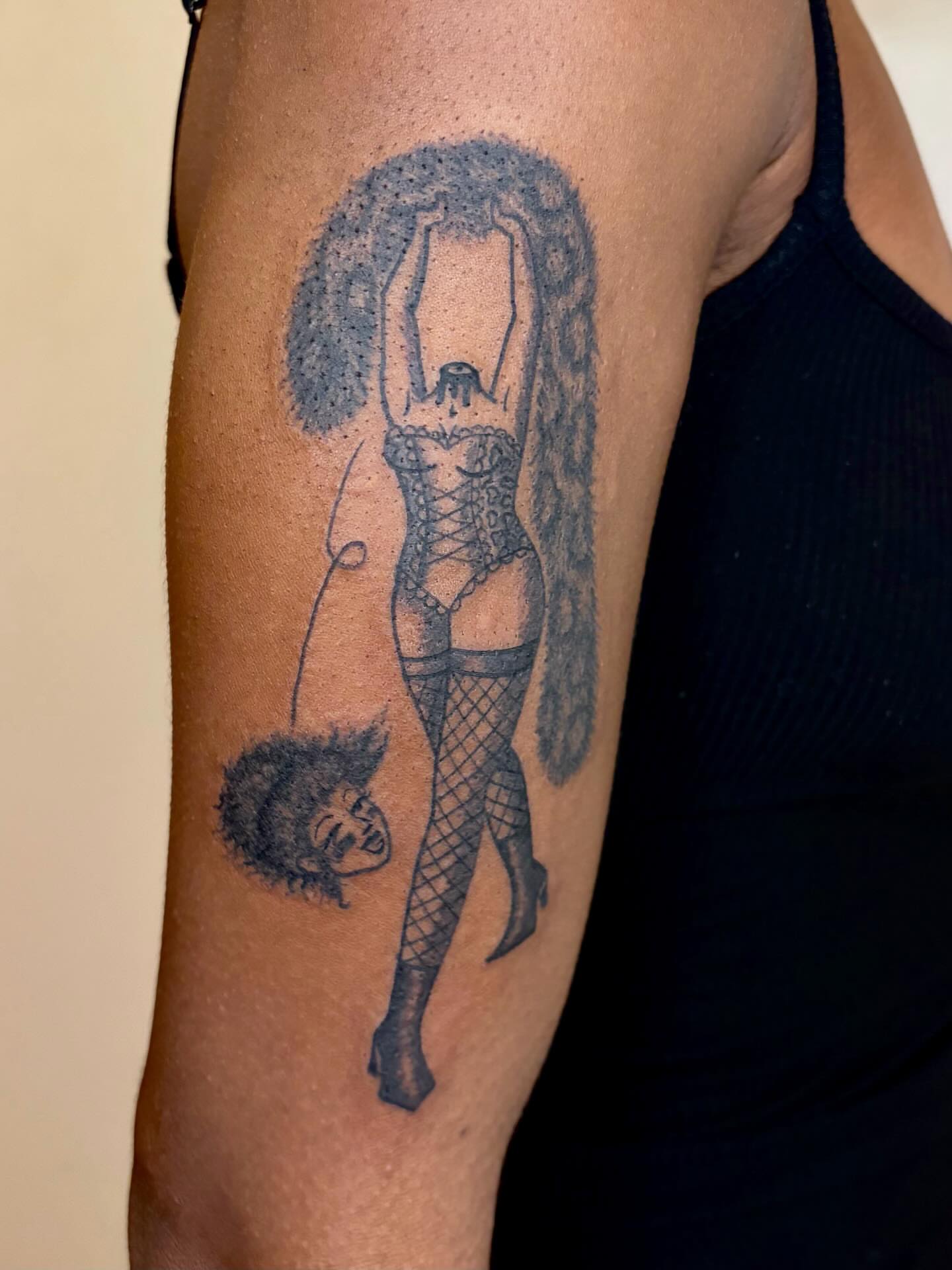 Pin-up girl black and grey tattoo on the forearm by Fin :