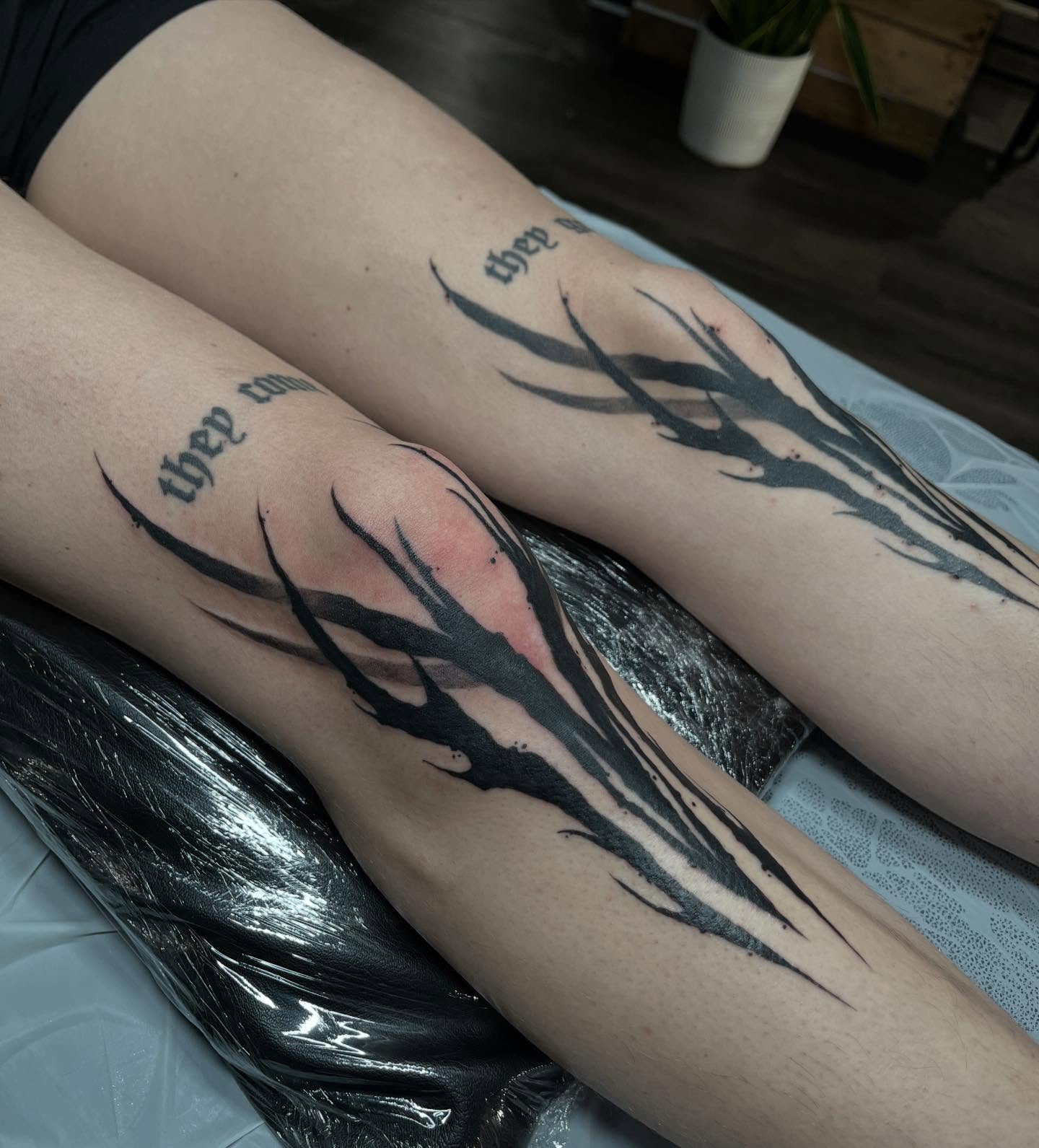 Abstract flame black and grey tattoo on the leg by Ty’s Tattoos