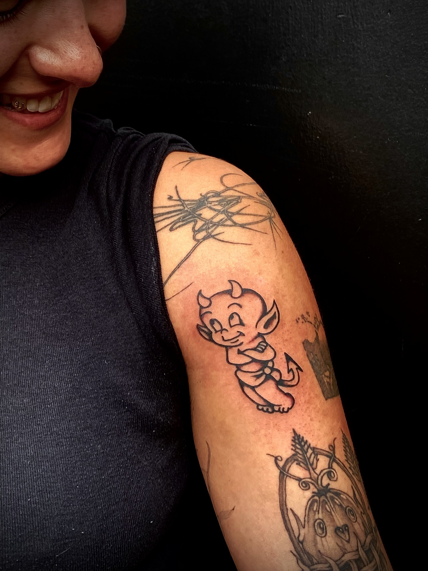 Baby devil American traditional tattoo on the forearm by Joey Delarosa, San Francisco, California