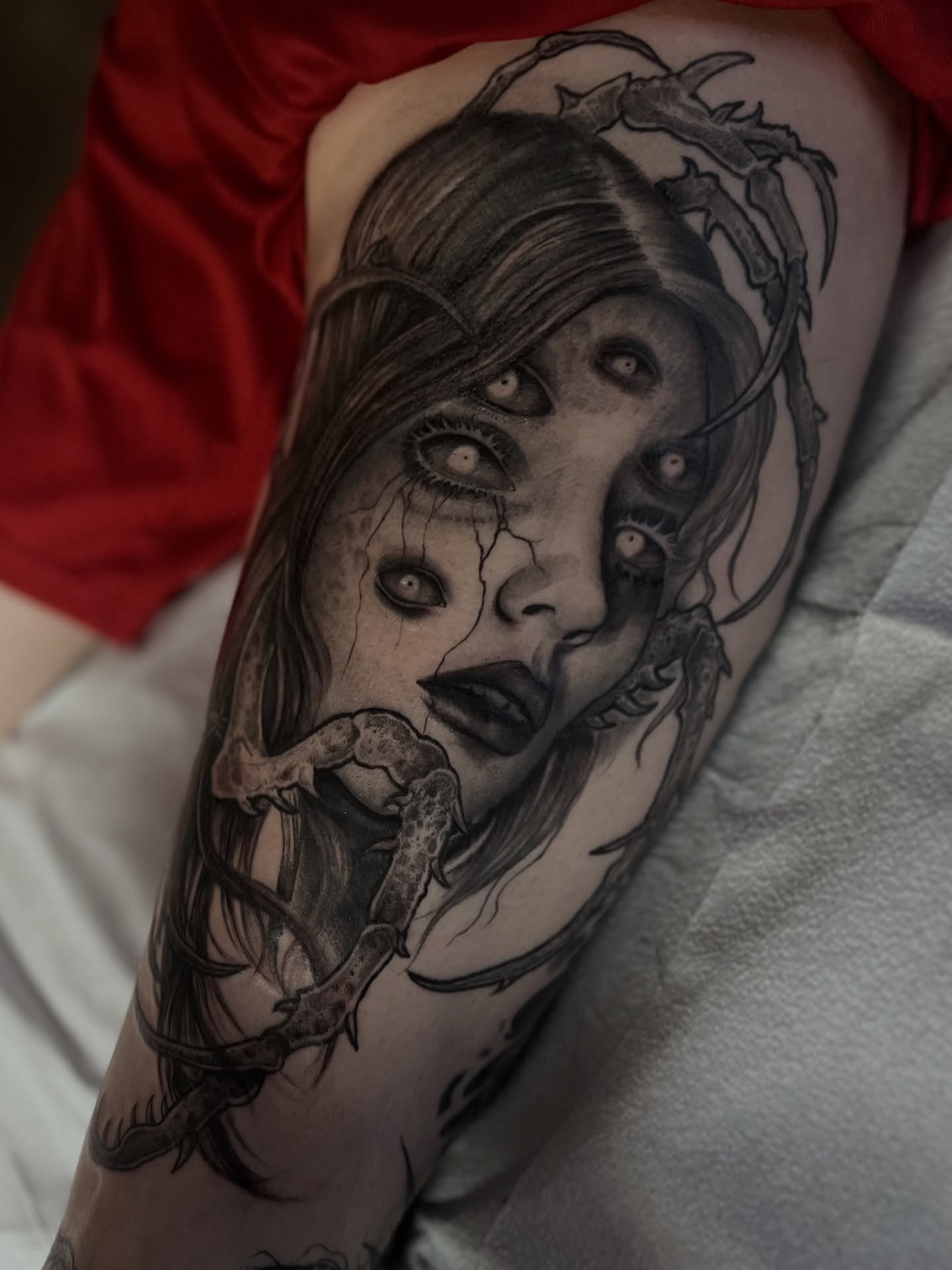 Woman with eyes dark realism tattoo on the forearm by Elaine Nerowski ☾