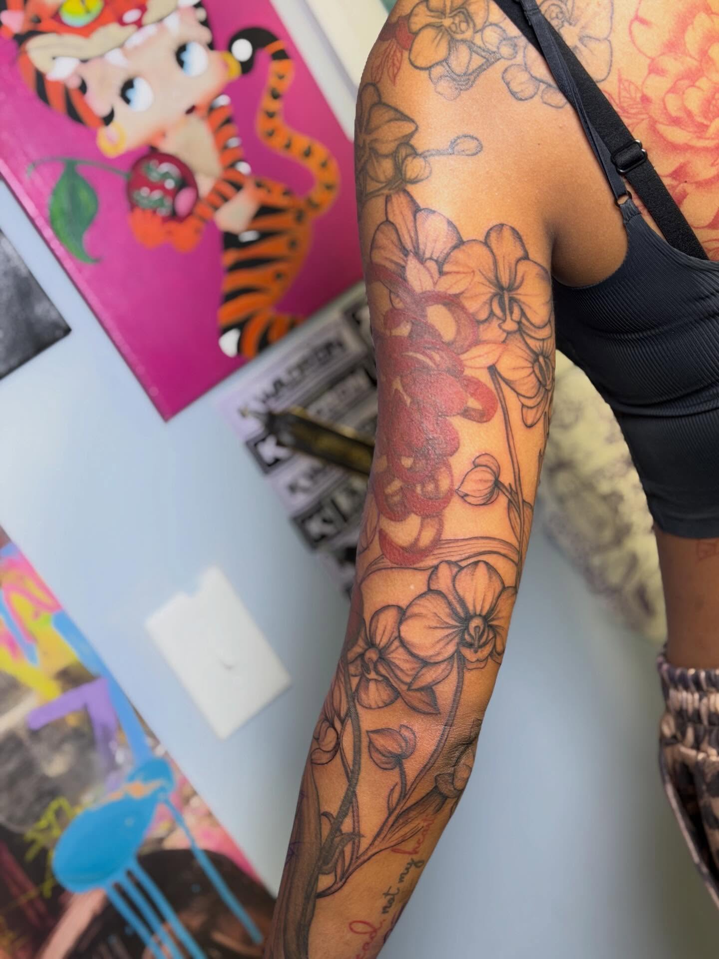 Floral arrangement black and grey tattoo on the forearm by Stephania ATLANTA TATTOO ARTIST🎨