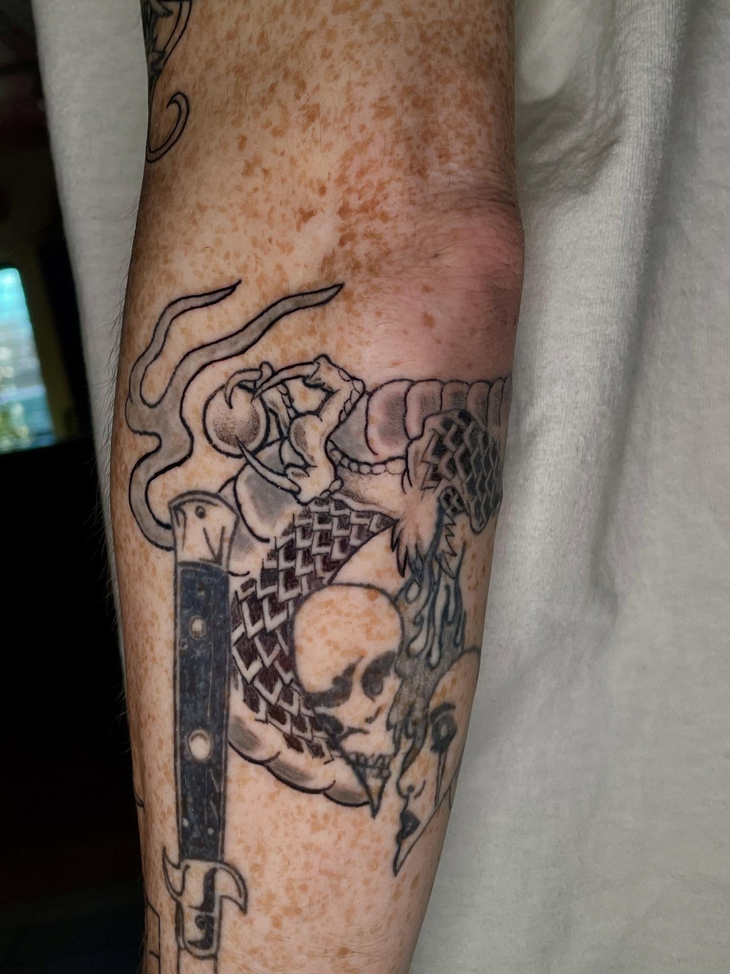 Skull and dagger black and grey tattoo on the forearm by ๐ท๐ซKevan๐๐ท