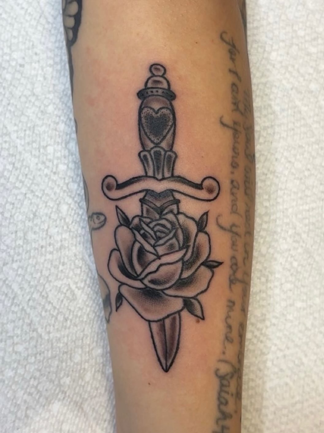 Sword and rose American traditional tattoo on the forearm by Molly Dixon