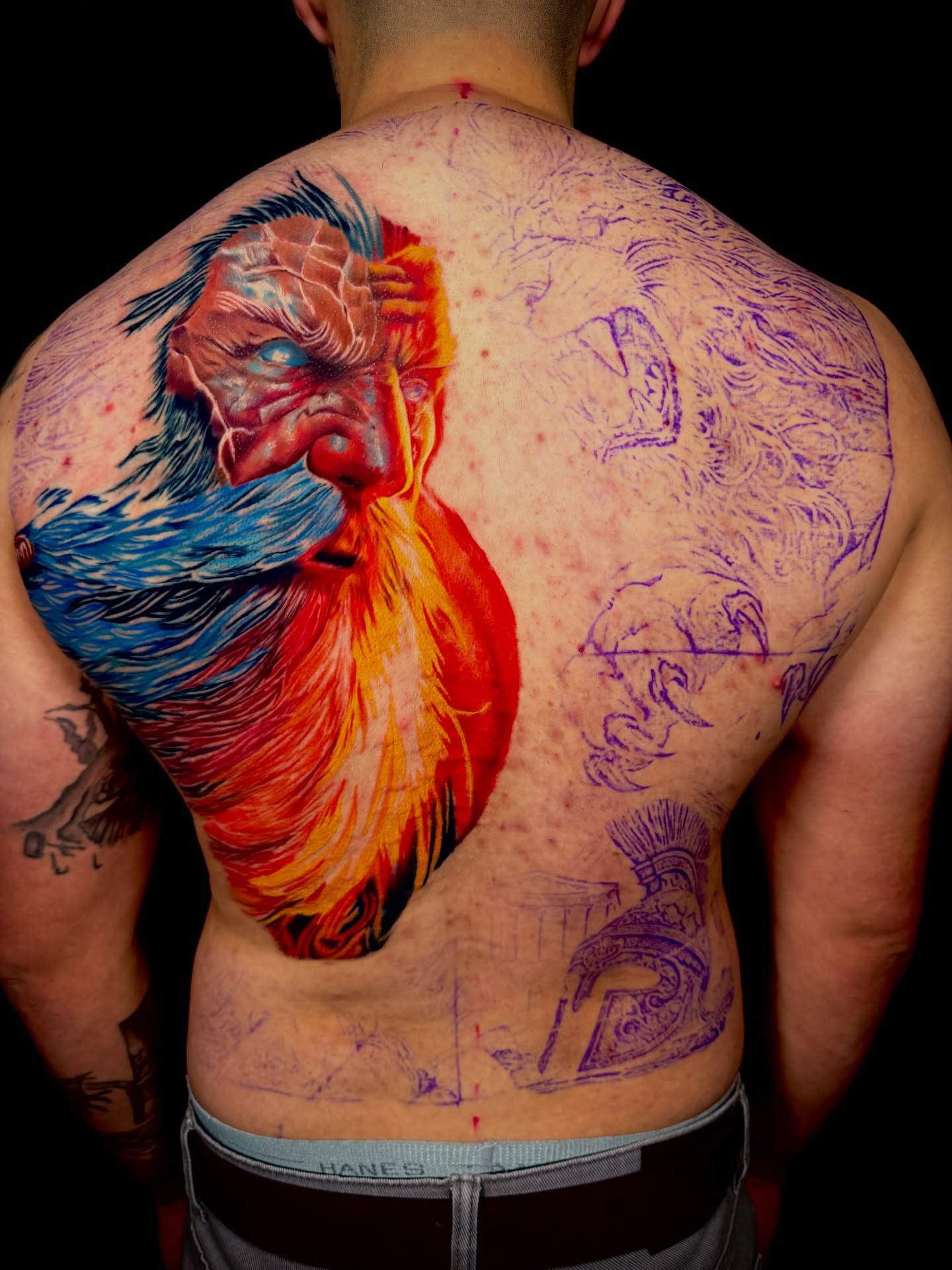 Monster illustrative tattoo on the back by John Ayson, Murrieta, California