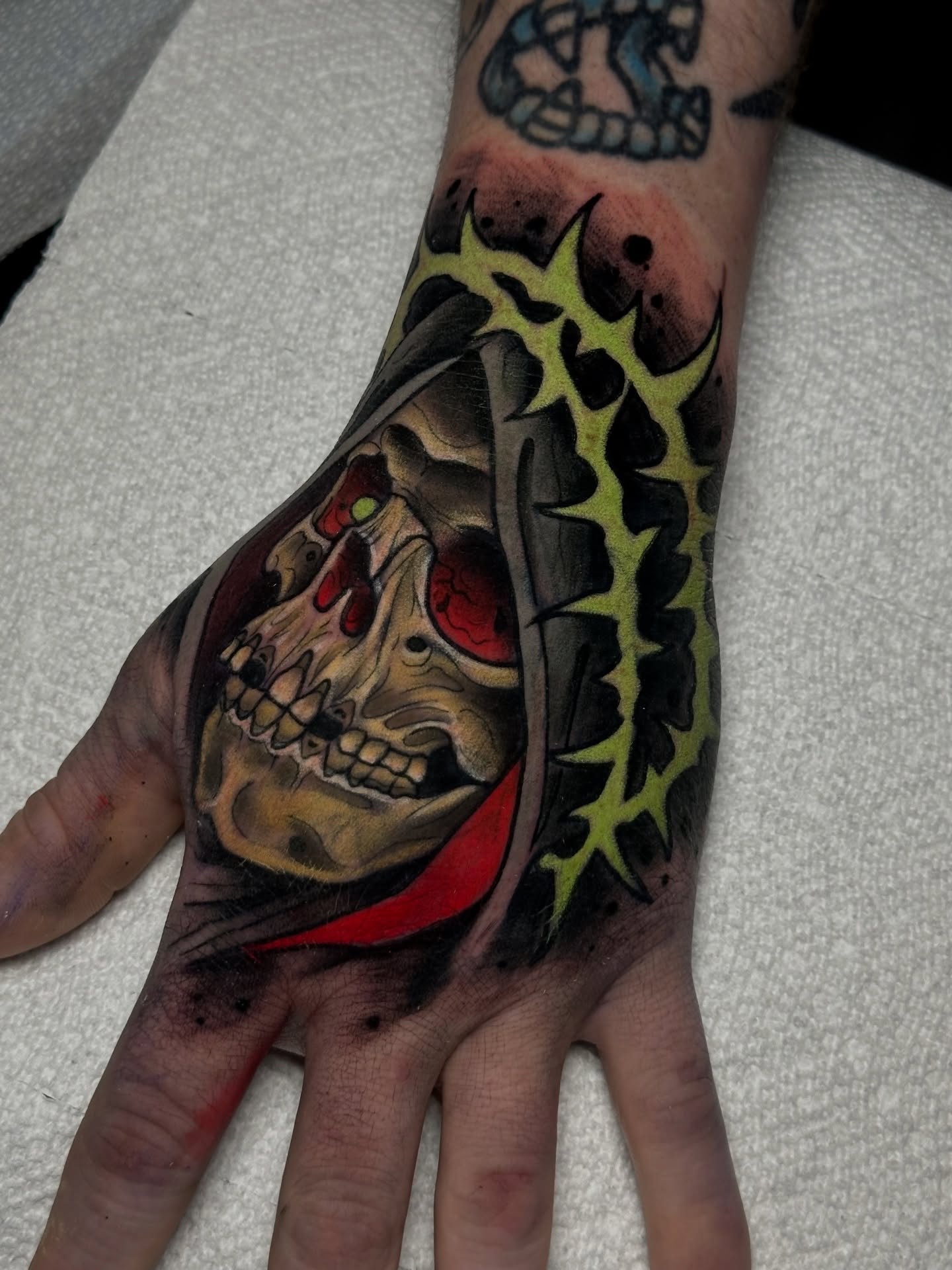 Skull with crown of thorns realism tattoo on the hand by 𝐀𝐮𝐬𝐭𝐢𝐧 𝐌𝐨𝐫𝐫𝐢𝐬𝐨𝐧 𝐓𝐚𝐭𝐭𝐨𝐨𝐬