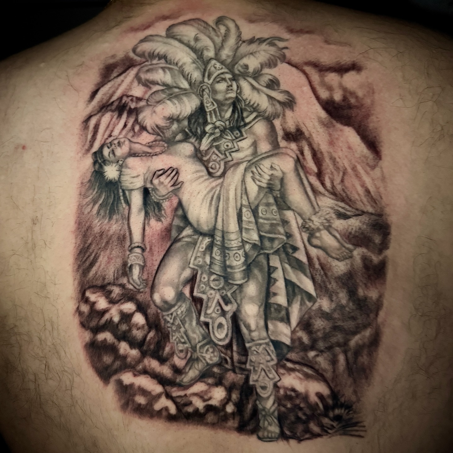 Aztec warrior and woman realism tattoo on the back by @mexcellent_tattoos