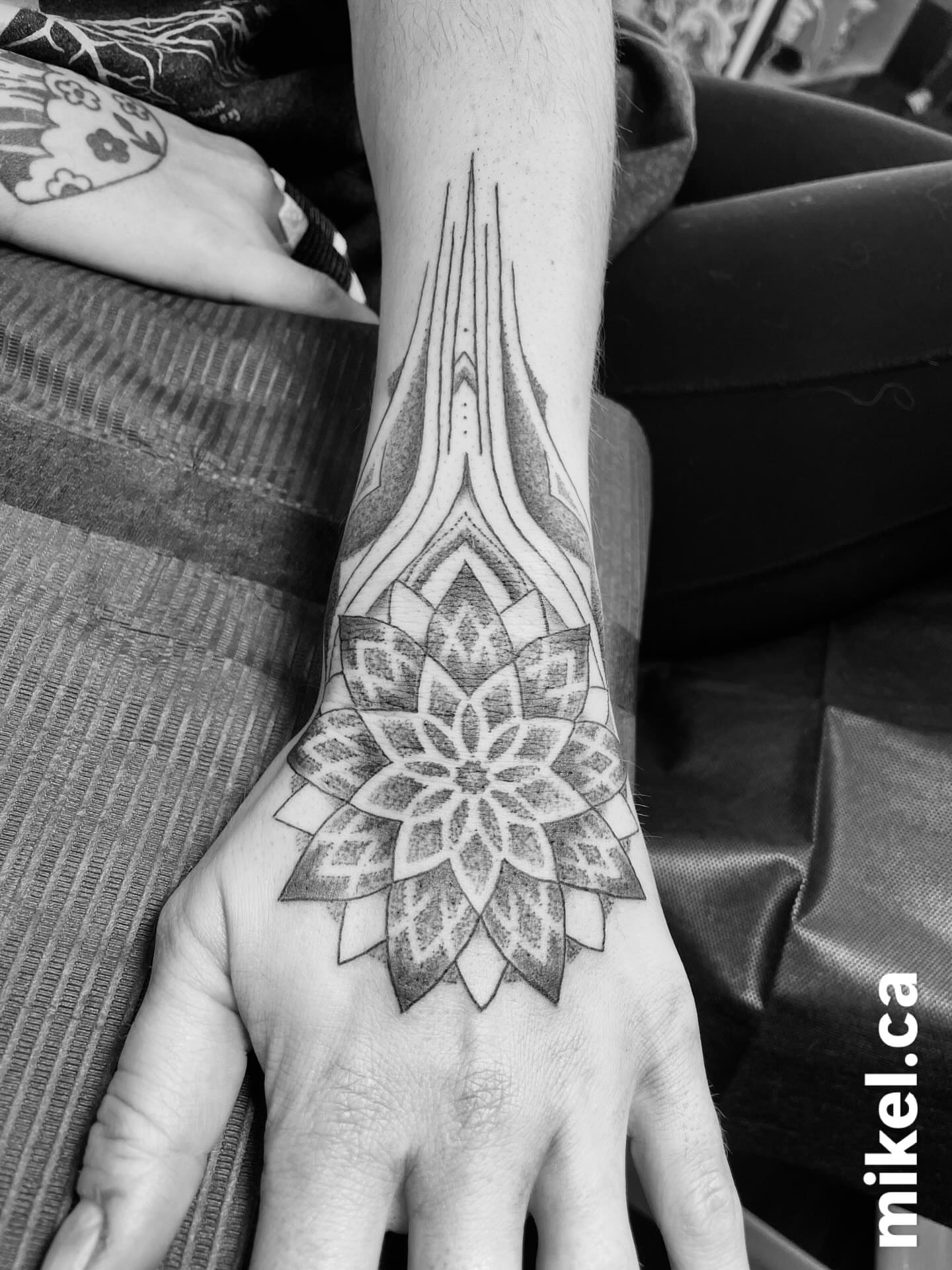 Lotus flower geometric tattoo on the hand by mikel_tattoosangha