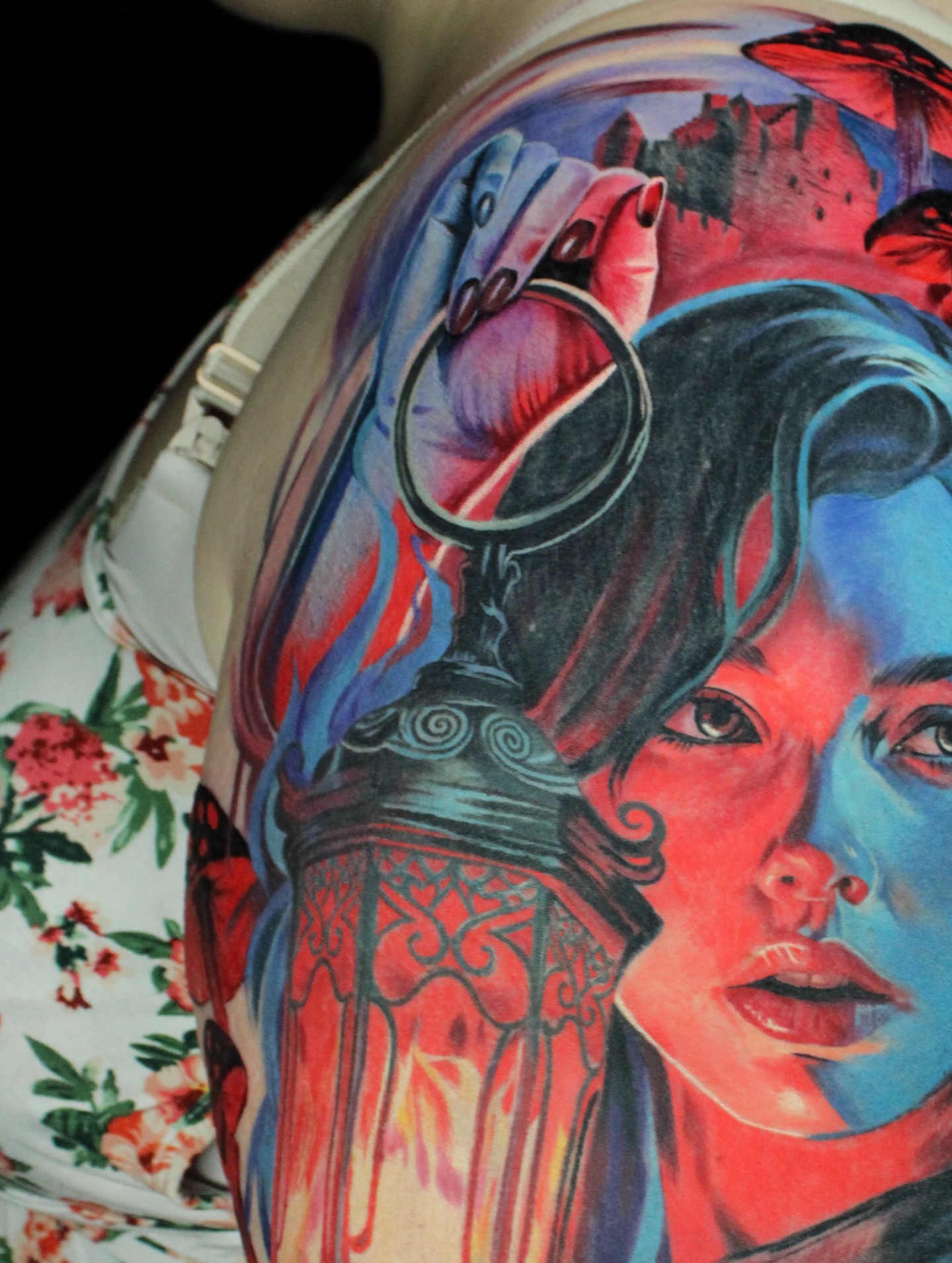 Woman's face realism tattoo on the shoulder by Eva Williams