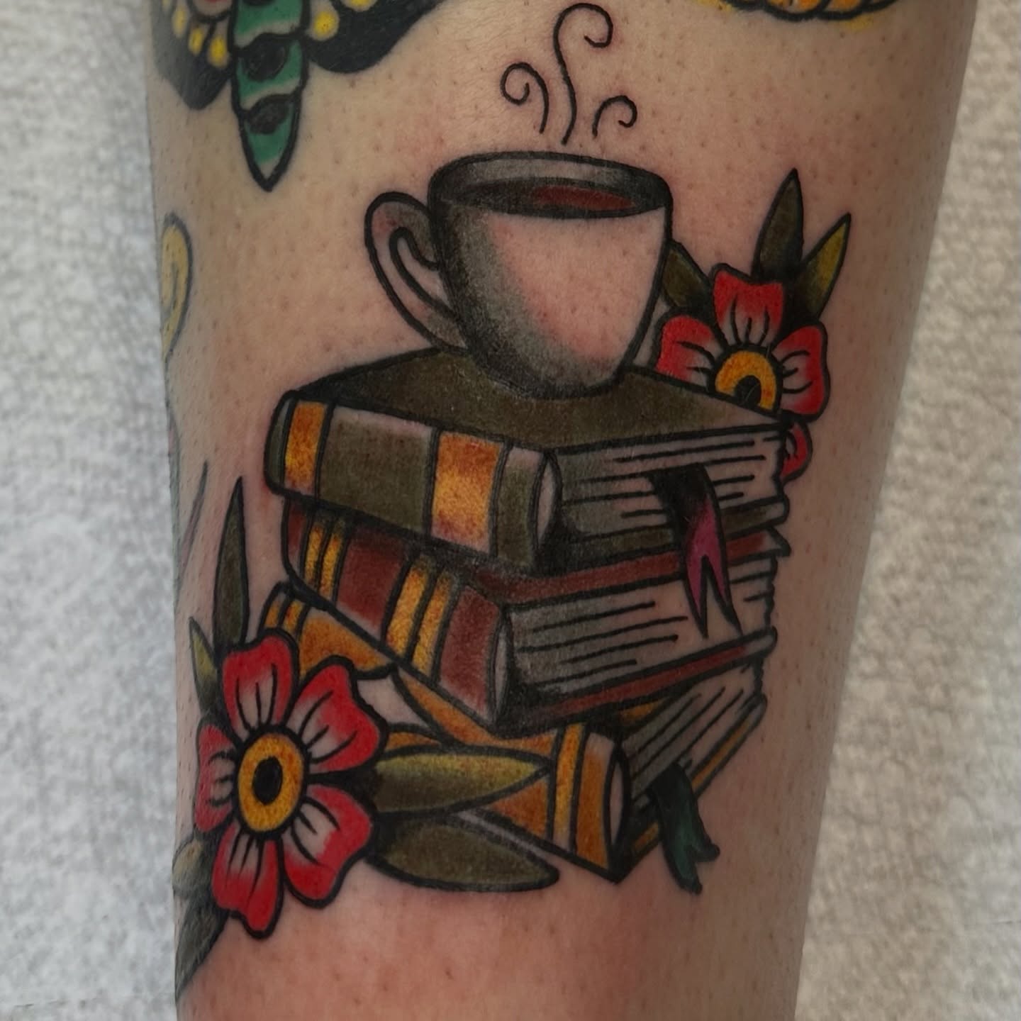 Coffee cup and books American traditional tattoo on the forearm by Nick Weaver aka gibby sometimes gilbert