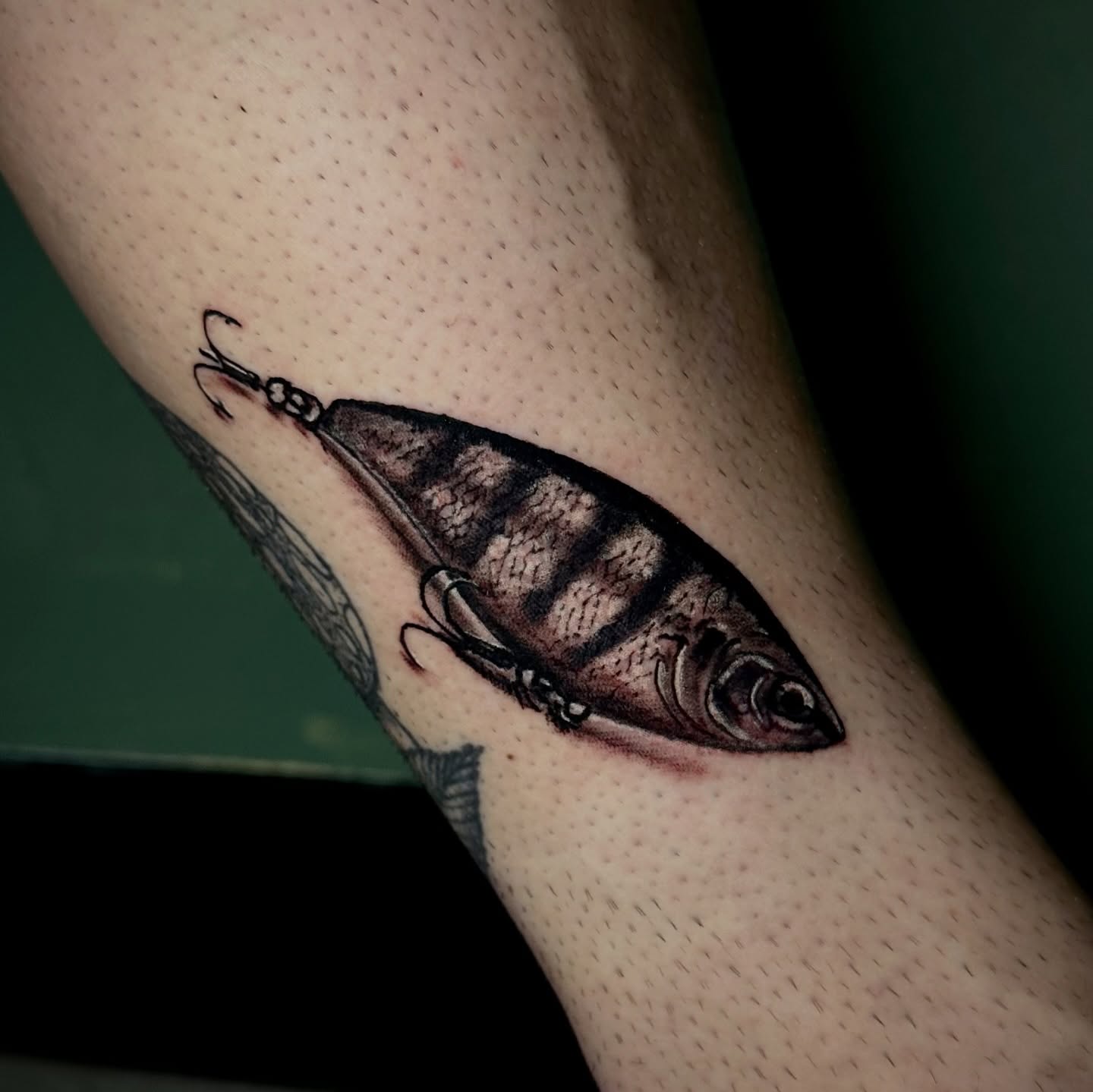 Fish lure realism tattoo on the forearm by Nick Weaver aka gibby sometimes gilbert