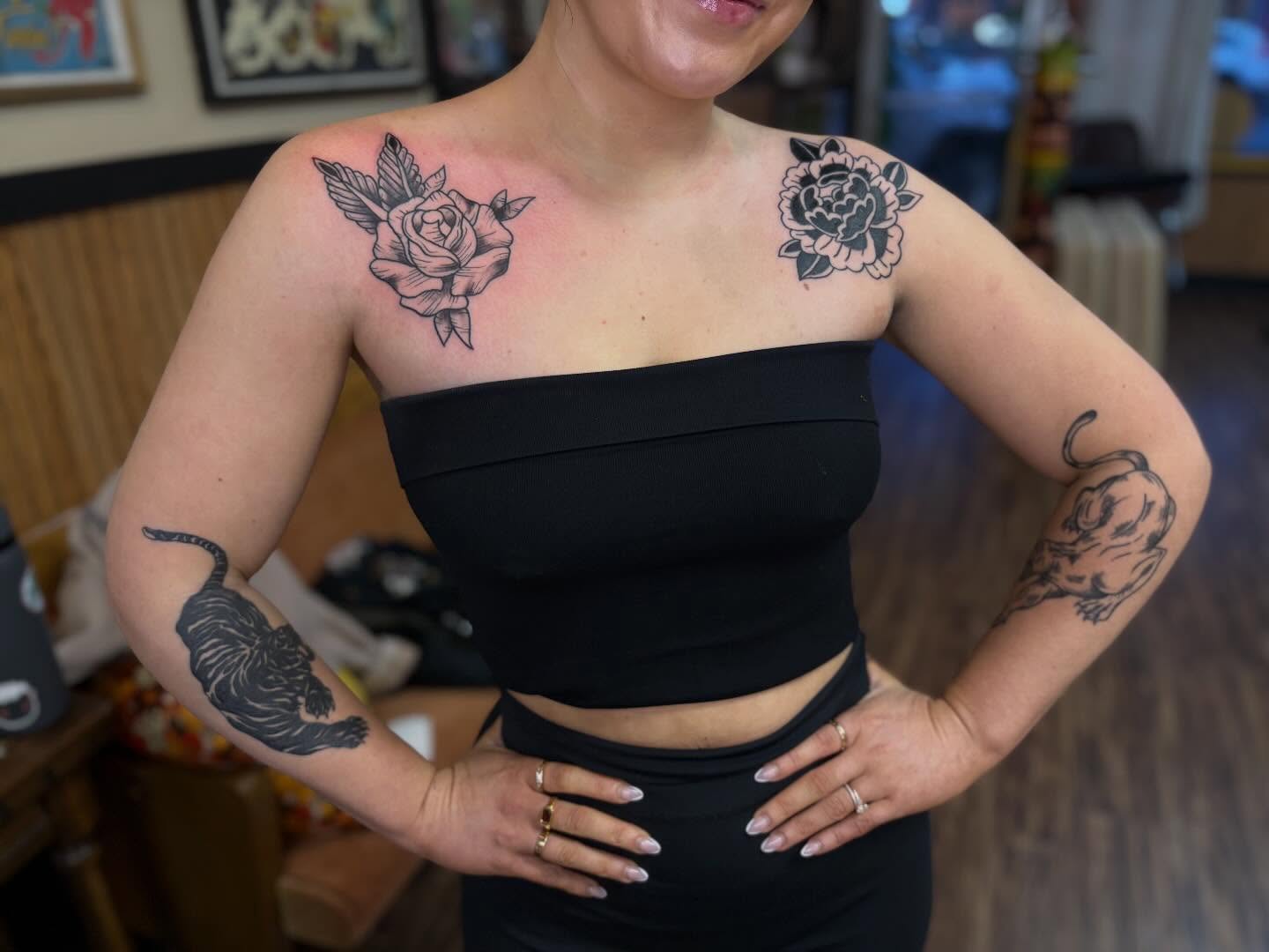 Rose and tiger black and grey tattoo on the chest by Lauren Deets