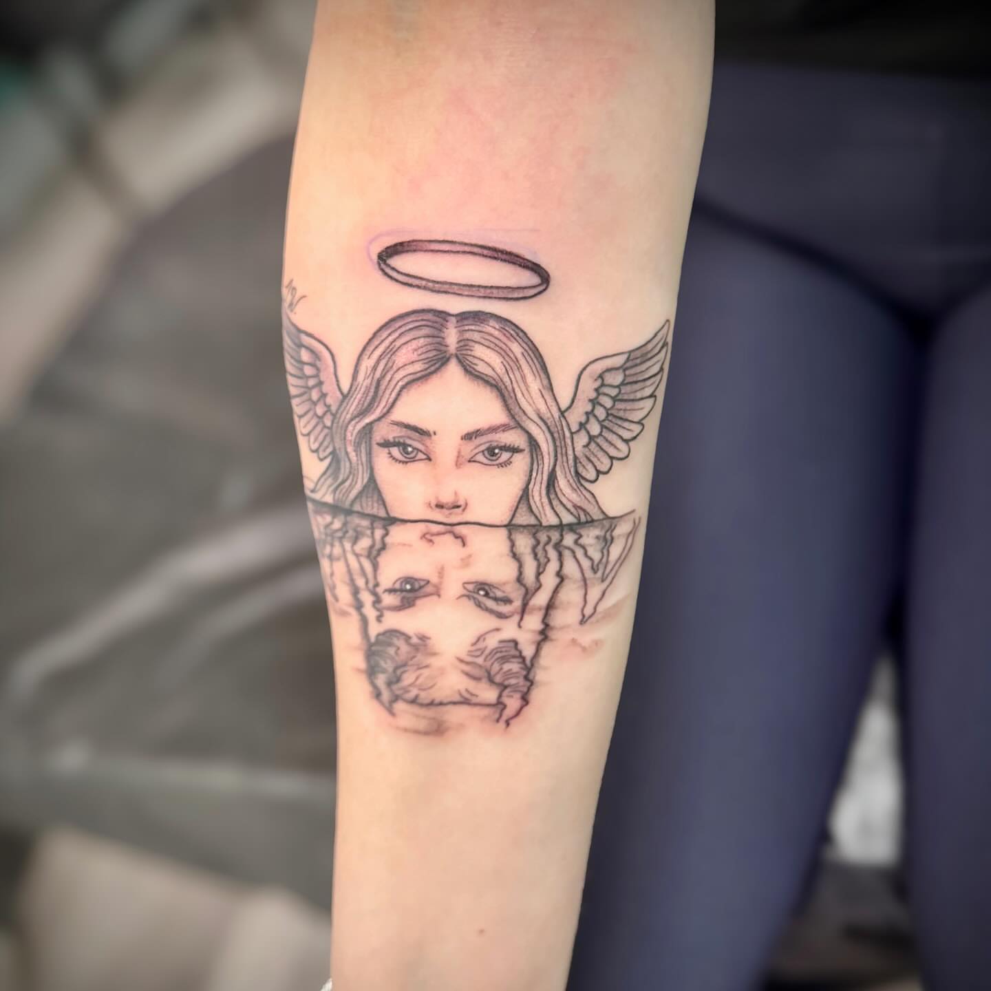 Angel reflection realism tattoo on the forearm by 🪬🍄Larissa Potter🍄🪬