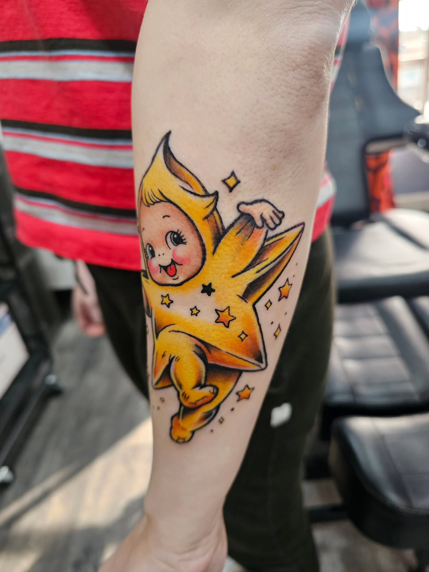 Star baby illustrative tattoo on the forearm by Matthew Ashmore