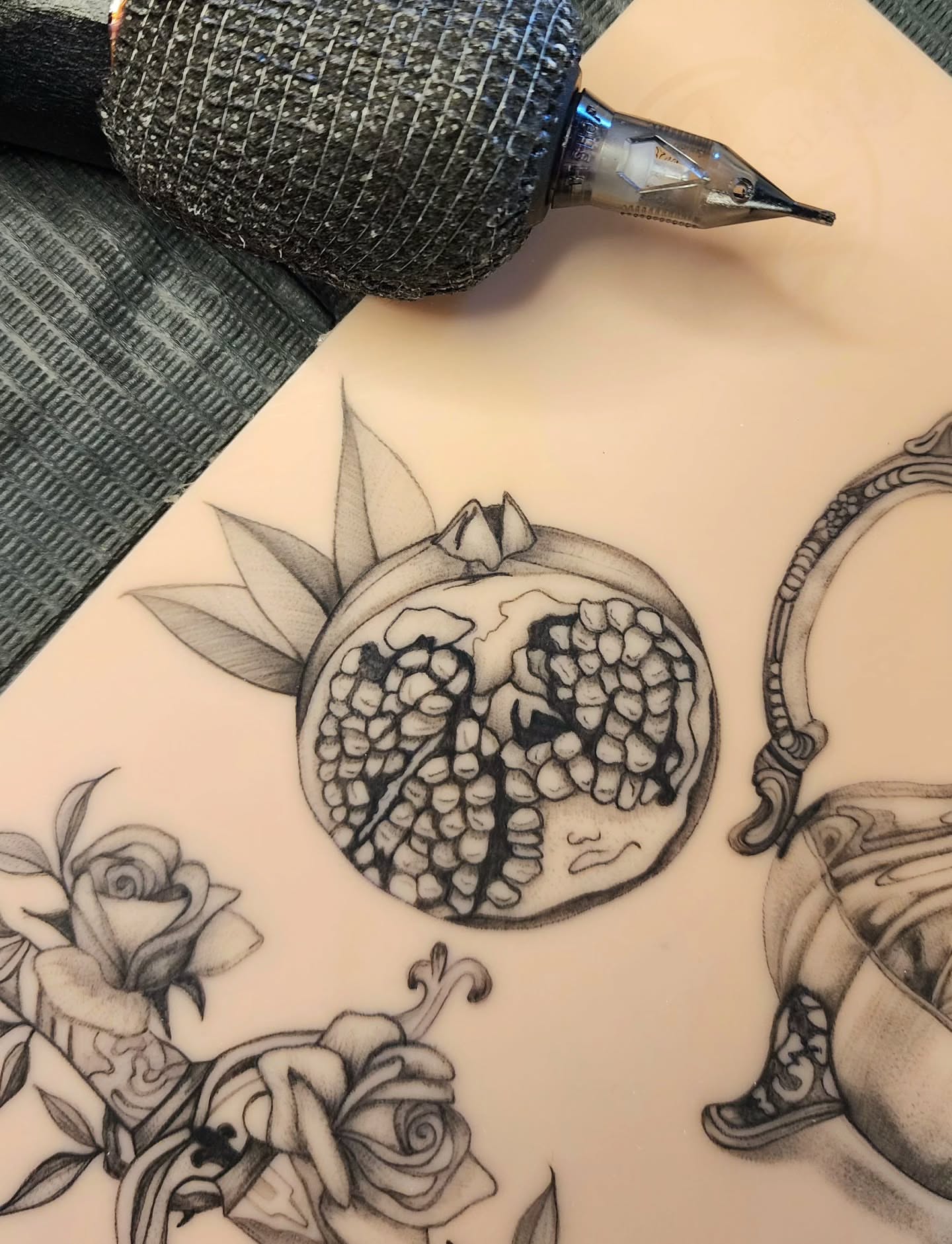 Pomegranate black and grey tattoo on the torso by Alex ▪︎ Tattoo Apprentice