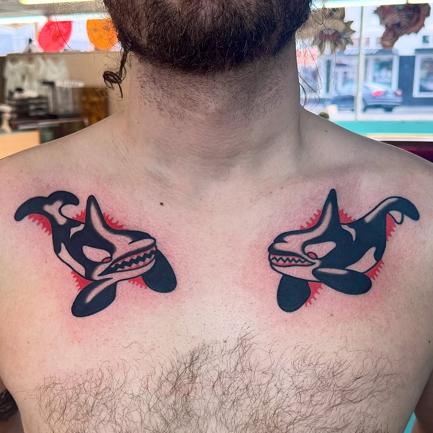 Orca sharks American traditional tattoo on the chest by Sam