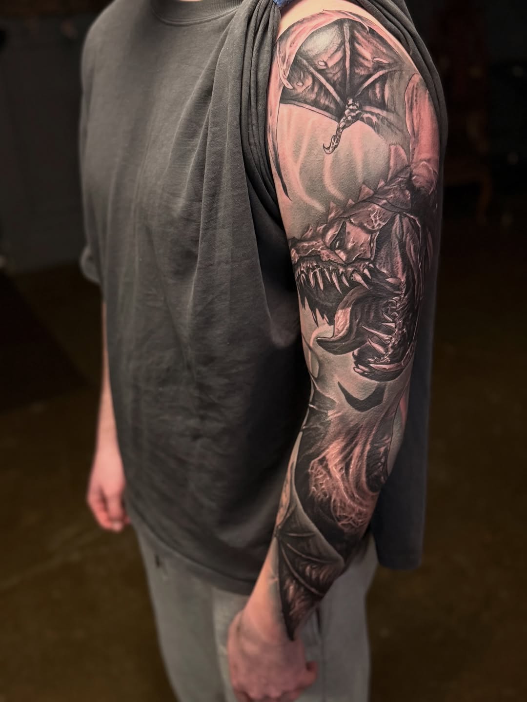 Dragon Japanese tattoo on the upper arm by Miles Haysmith
