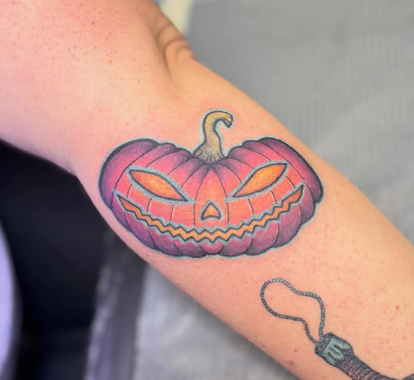 Jack-o'-lantern realism tattoo on the forearm by Olivia Buch