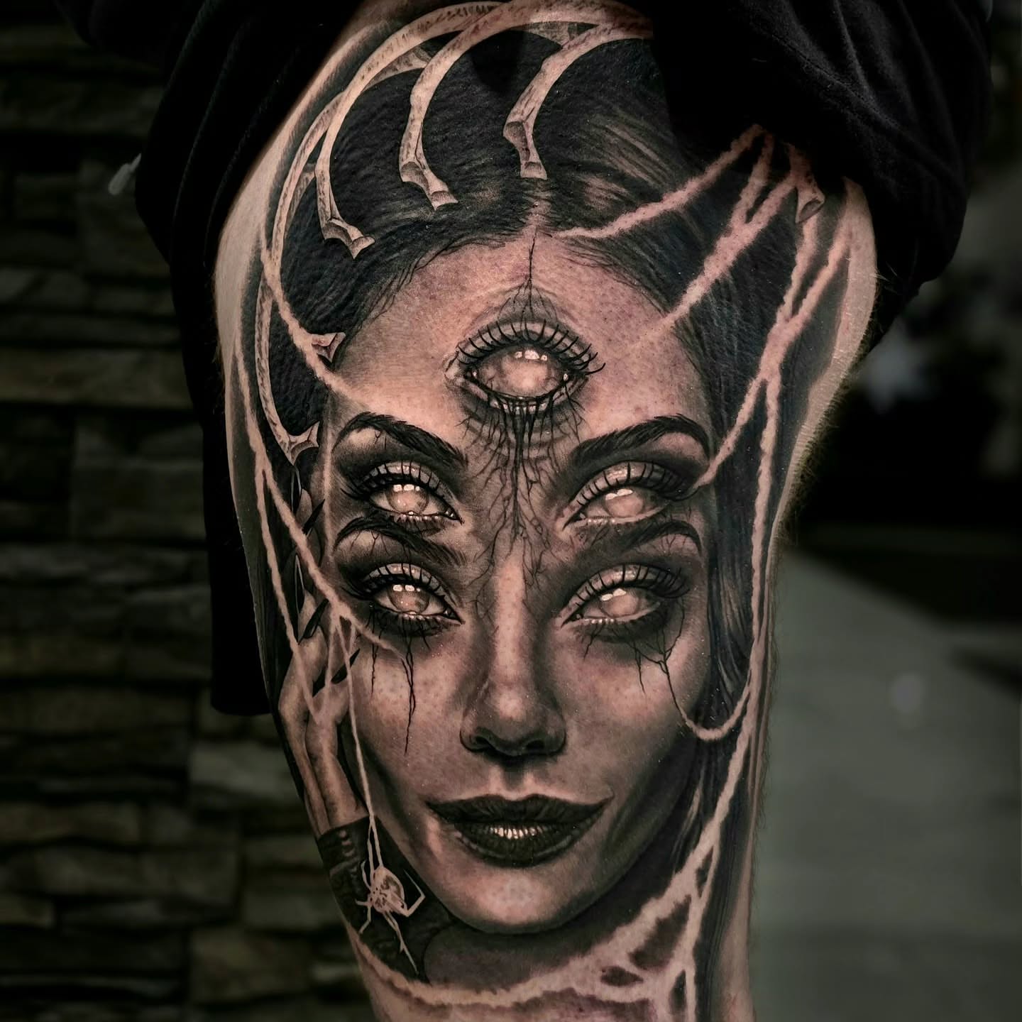 Woman's face realism tattoo on the forearm by Julia Oravets