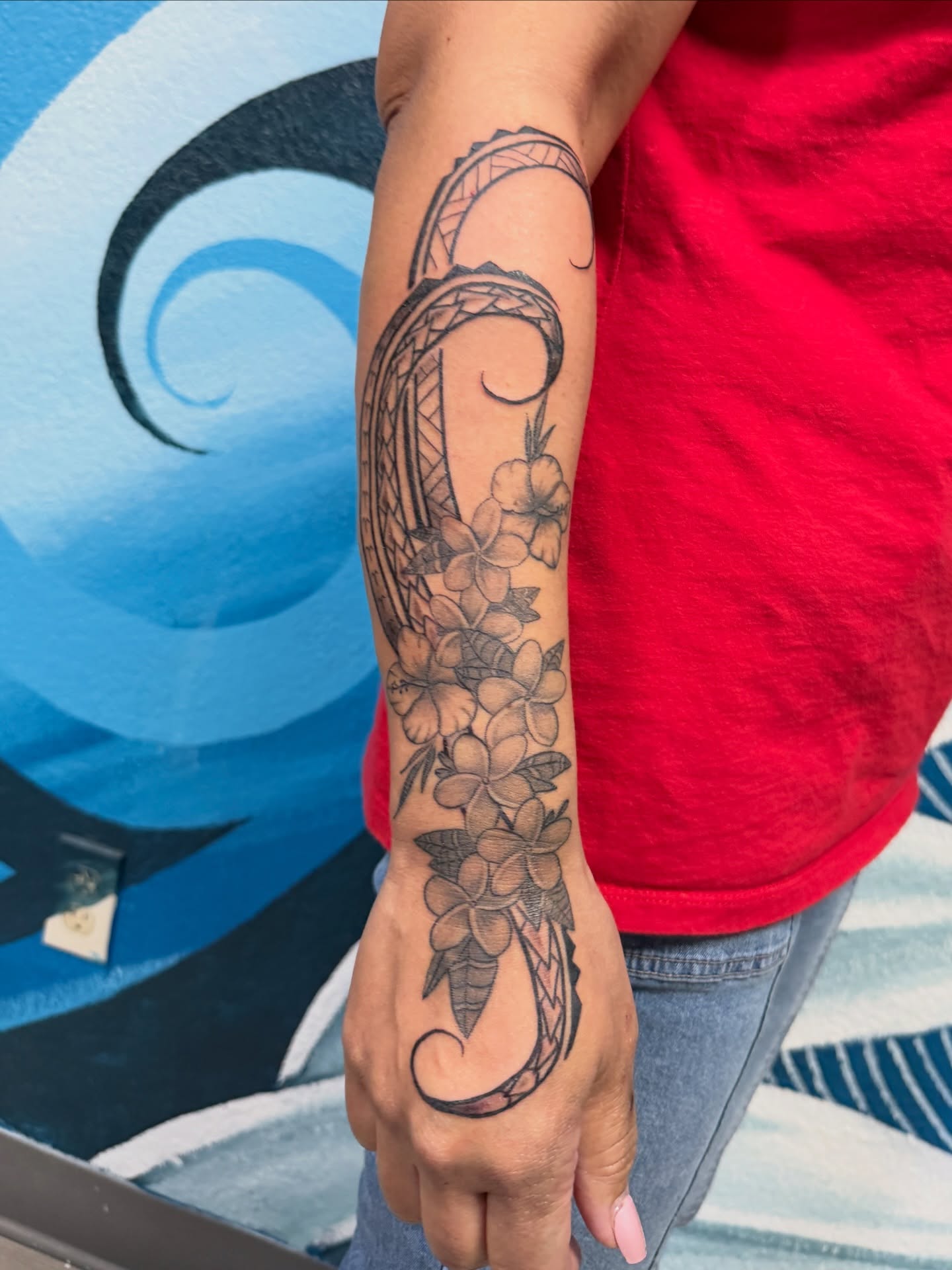 Plumeria flowers black and grey tattoo on the forearm by Kevin, Las Vegas, Nevada