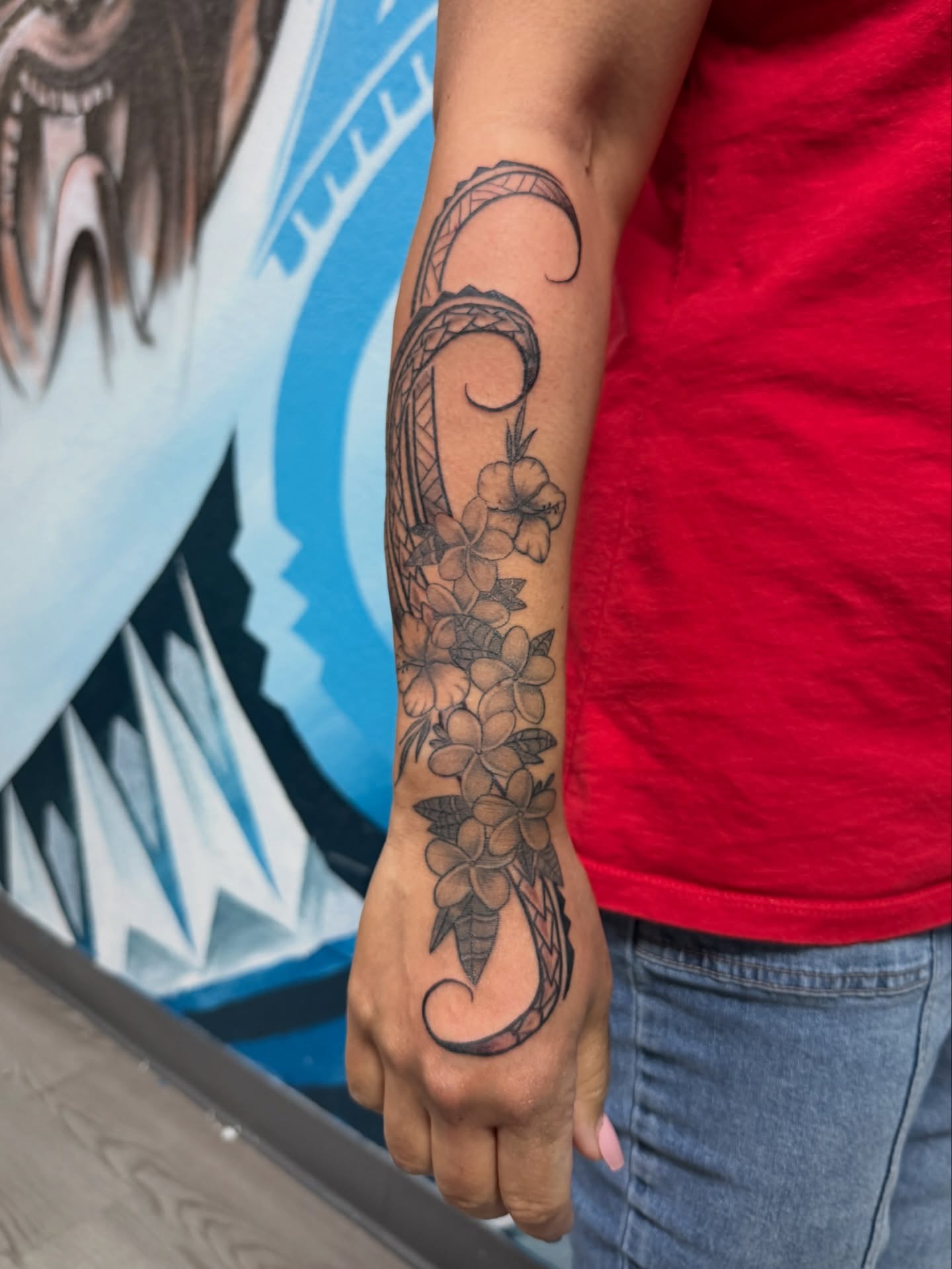 Wave and flowers black and grey tattoo on the forearm by Kevin, Las Vegas, Nevada