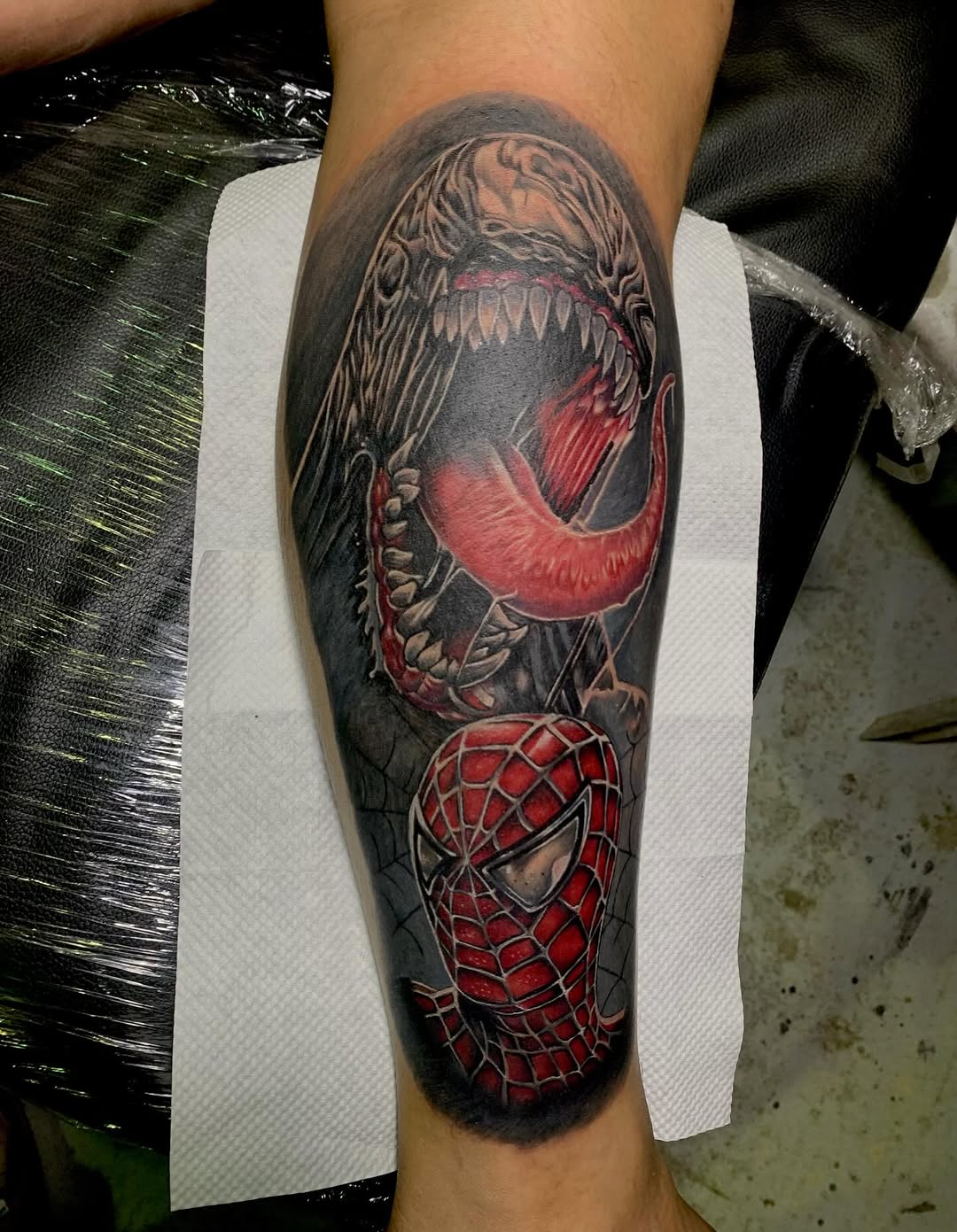 Venom and Spider-Man realism tattoo on the forearm by Gerd thINK_TATTOO