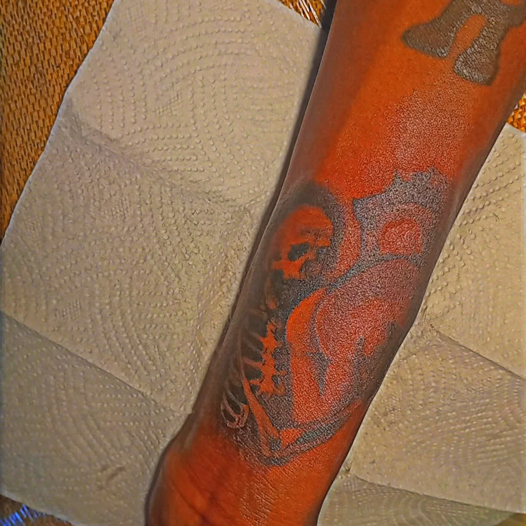 Skull and wings American traditional tattoo on the forearm by Mwangaza Bodyworks, Uthiru, Nairobi Area, Kenya