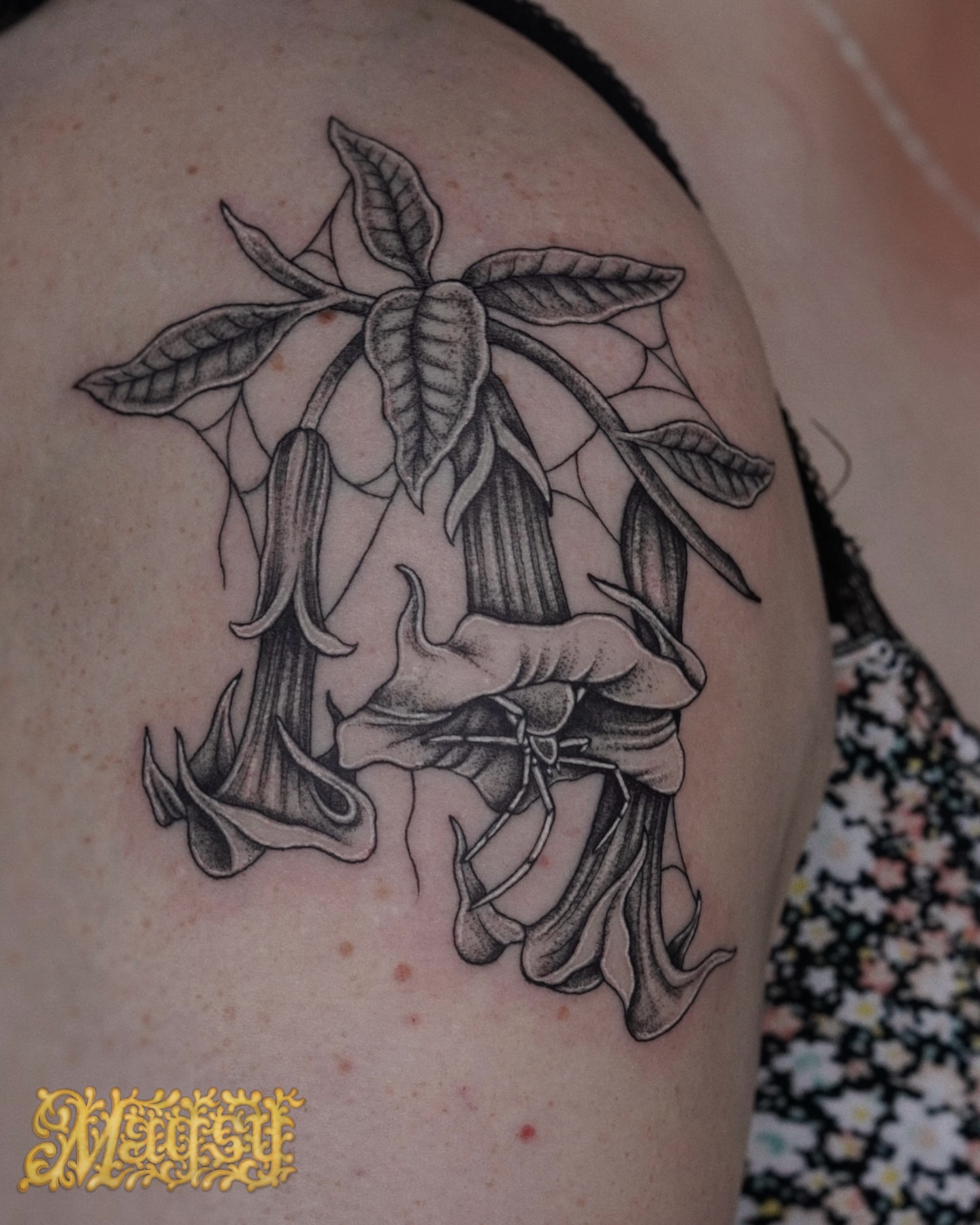 Datura flowers black and grey tattoo on the shoulder by Magsy, Orange, California