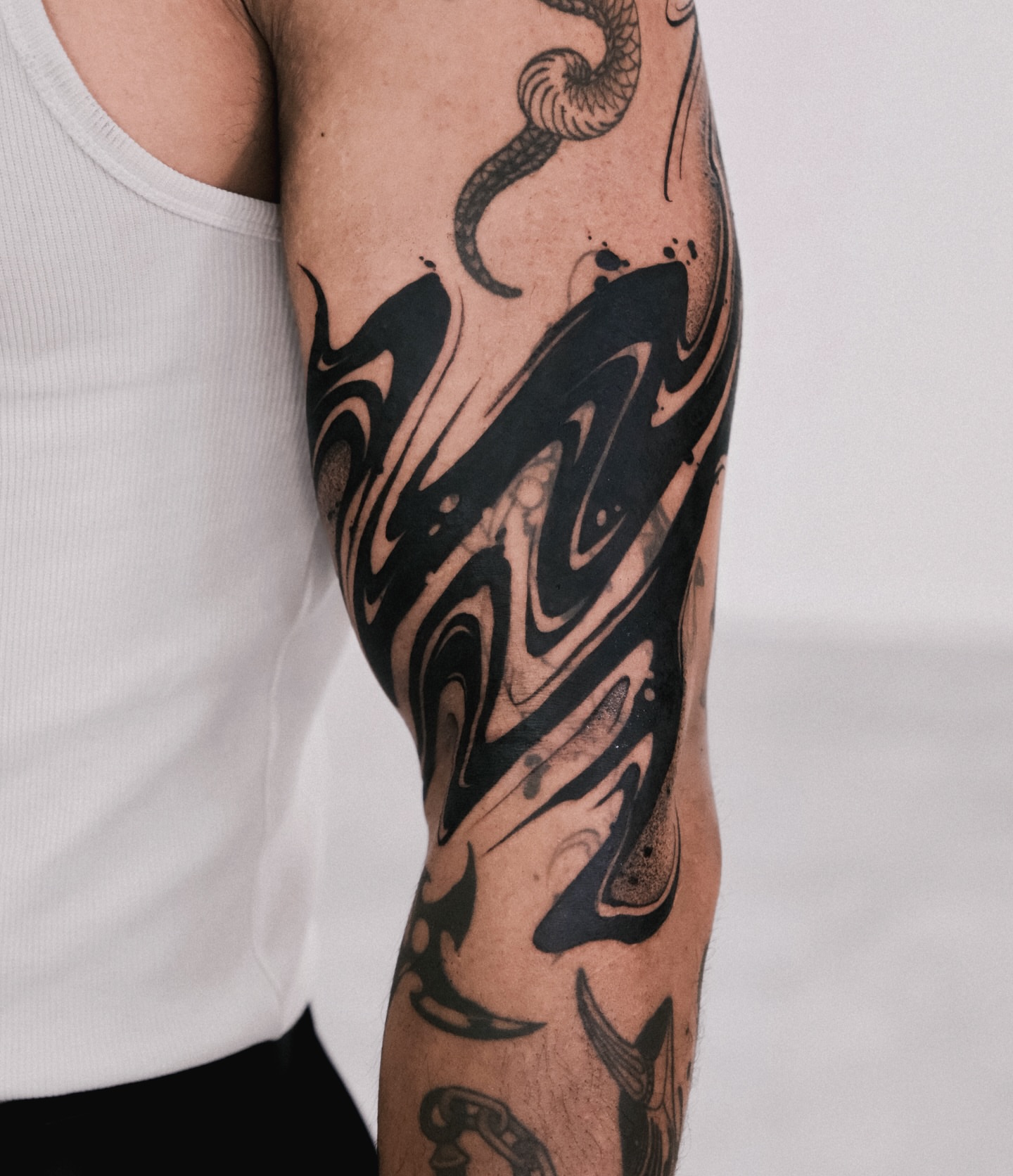 Abstract swirls tribal tattoo on the forearm by Perth tattoo 류, Perth, Western Australia