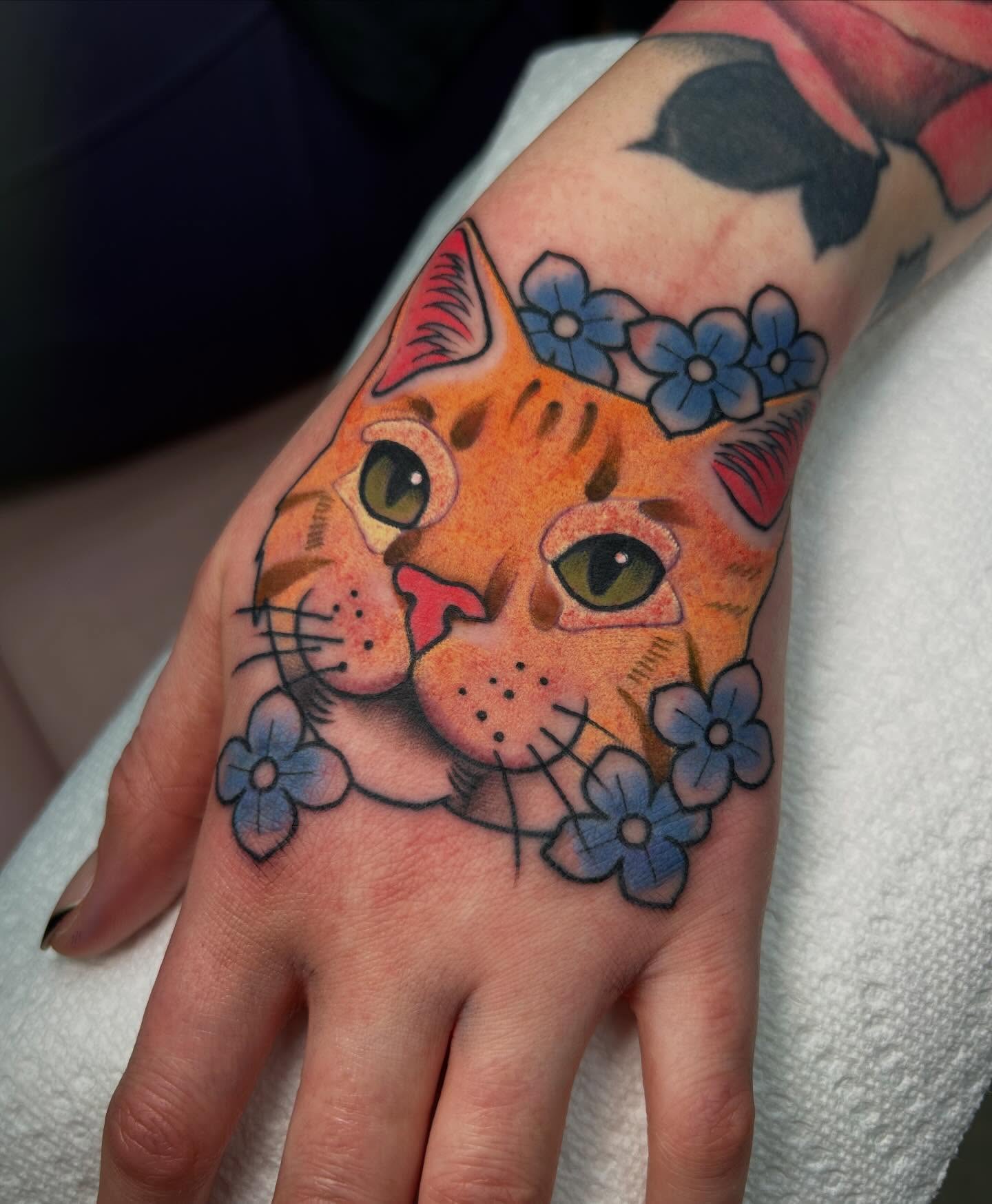 Cat American traditional tattoo on the hand by Katie Dexter, Des Moines, Iowa