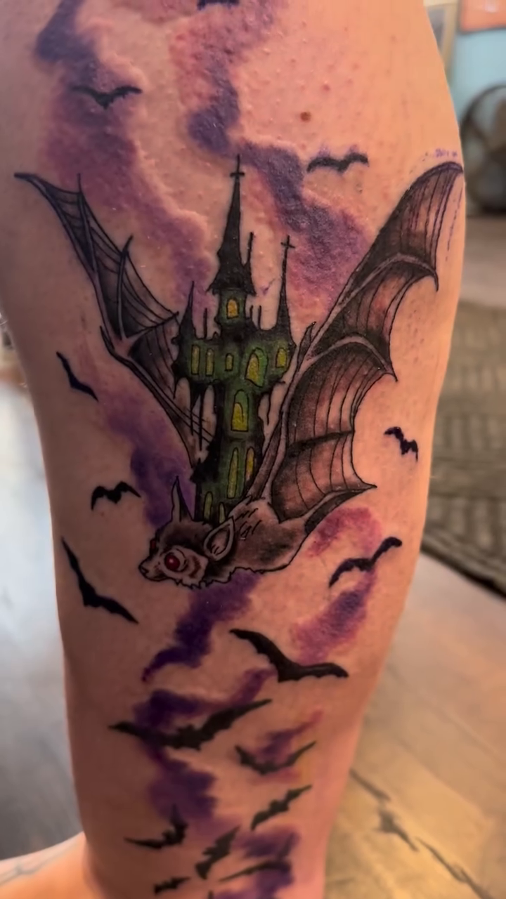 Haunted castle with bat wings dark realism tattoo by Misty Dawn Brothers, Dayton, Ohio