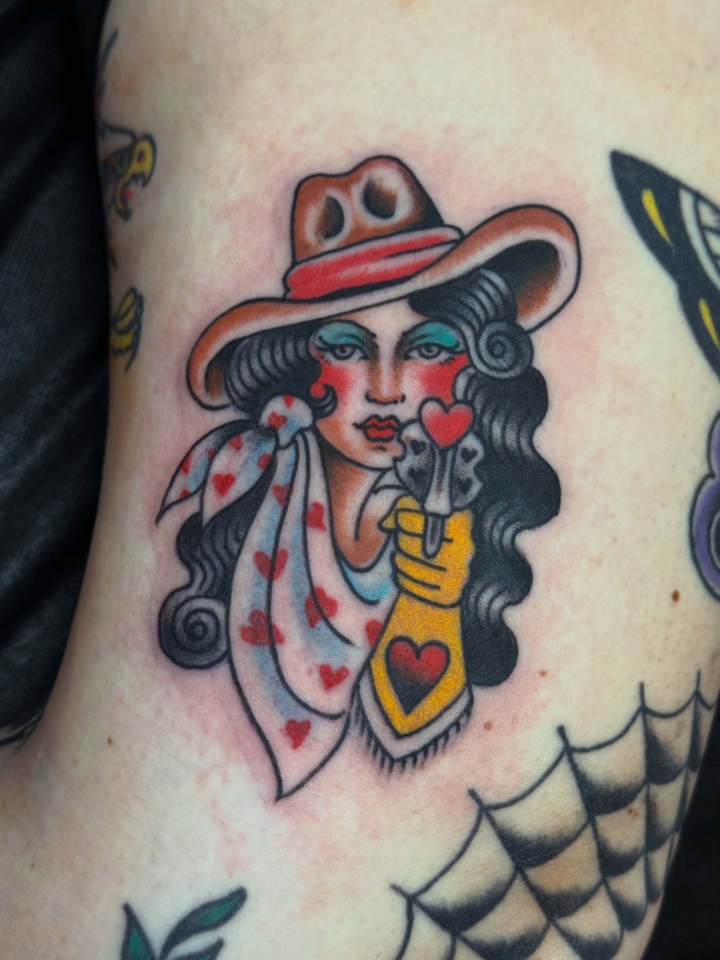 Cowgirl American traditional tattoo on the thigh by Ben Karnofsky