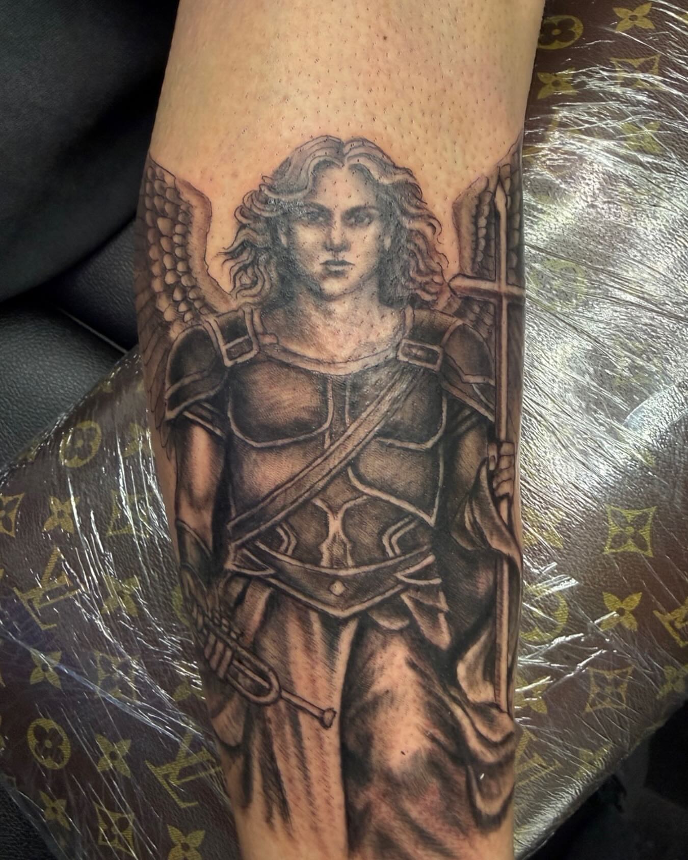 Angelic warrior realism tattoo on the forearm by Germaine Sherman
