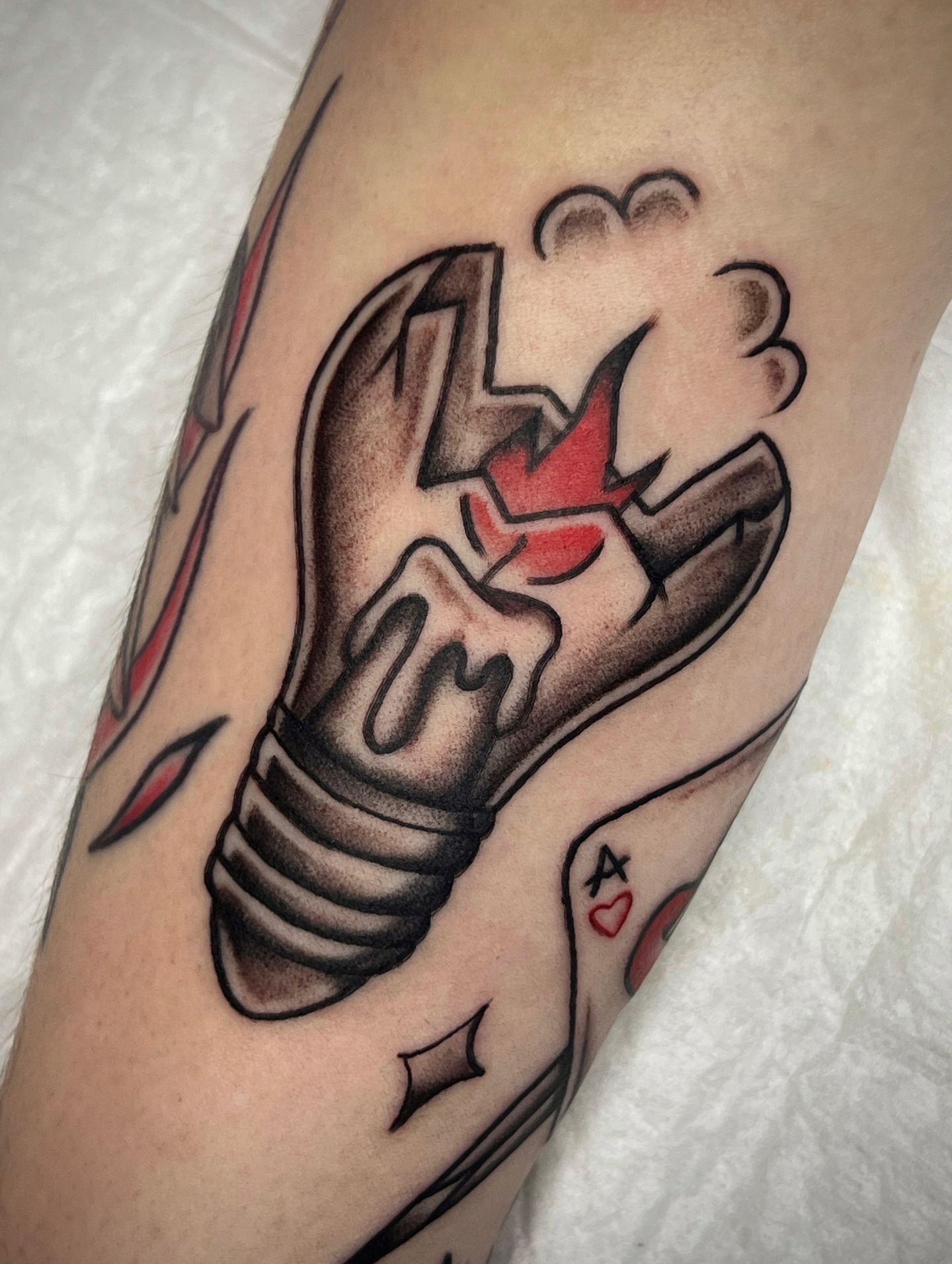 Light bulb American traditional tattoo on the forearm by Black and color tattoo!