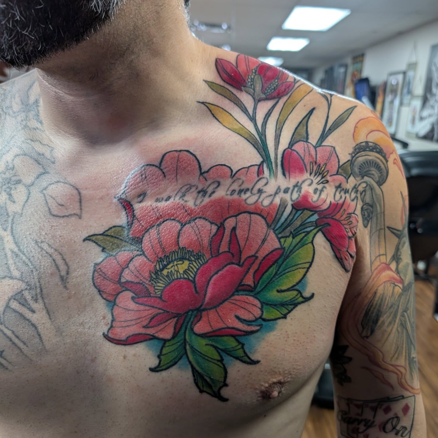 Peony and floral arrangement American traditional tattoo on the chest by Will Alexander, Lombard, Illinois