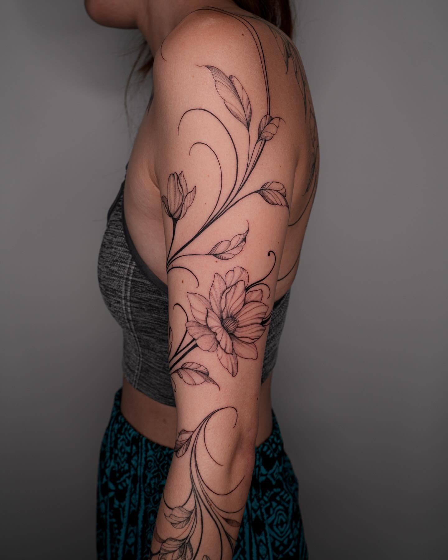 Floral design black and grey tattoo on the upper arm by Pandora ✨ Floral, Los Angeles, California