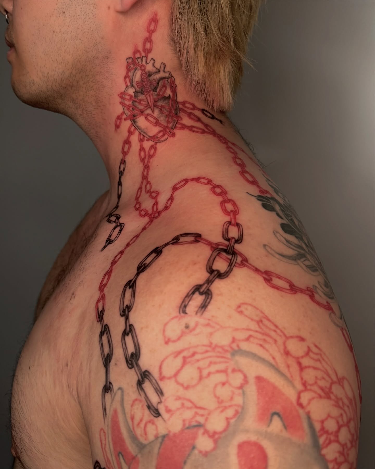 Chains and heart American traditional tattoo on the shoulder by Sab