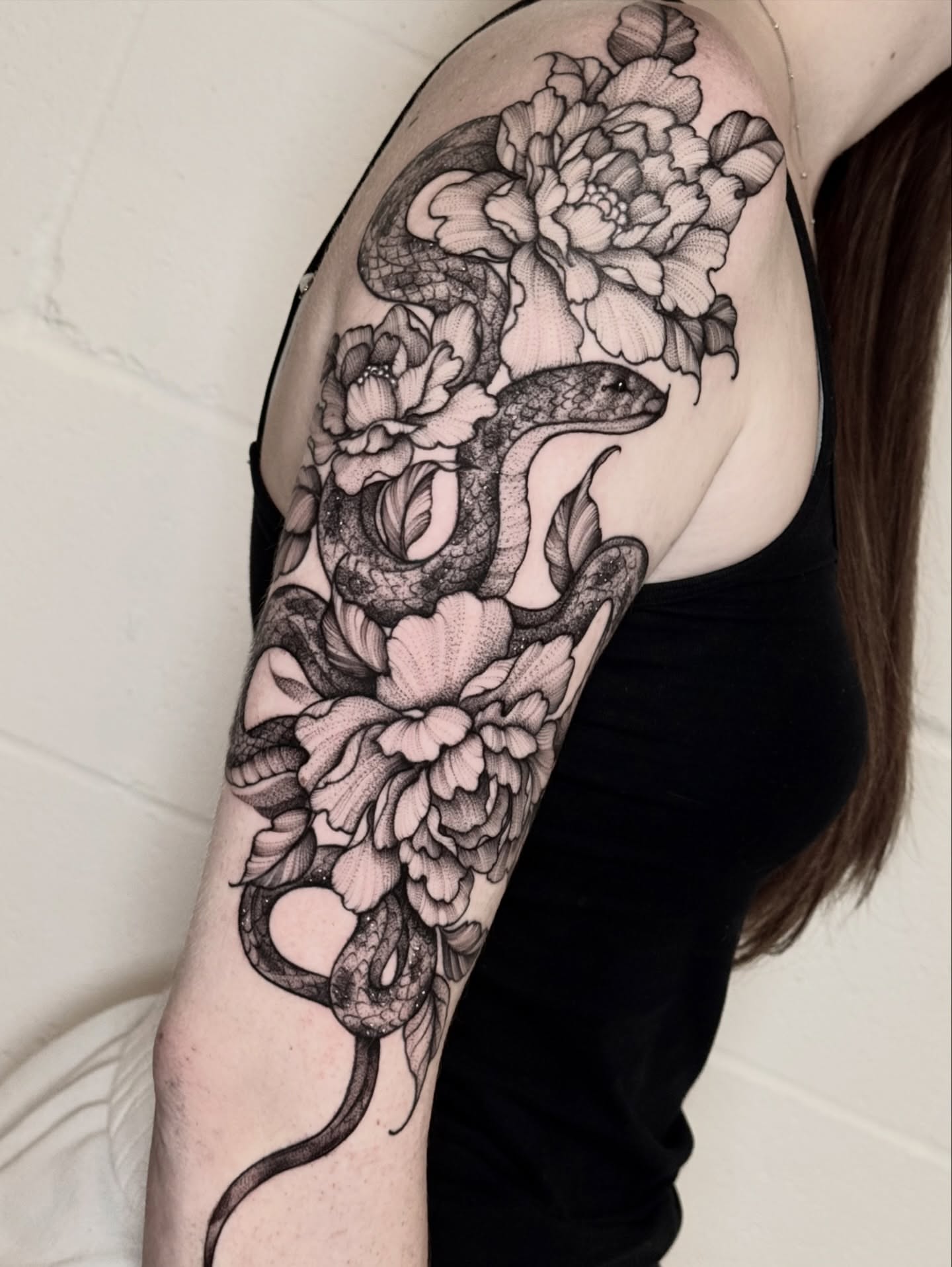Snake and peony realism tattoo on the shoulder by ℳ𝒾𝓇𝓉𝒽𝒶 𝒯ℴ𝓇𝓇ℯ𝓈, San Diego, California
