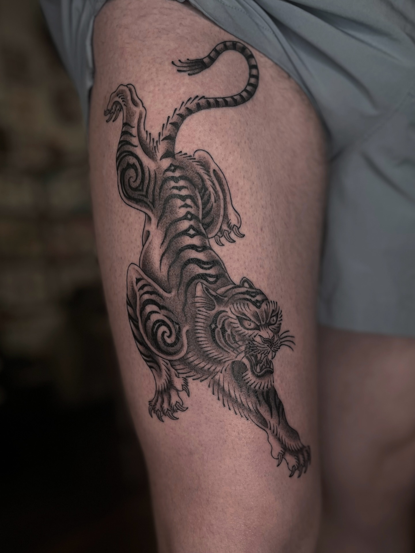 Tiger black and grey tattoo on the thigh by Tattoo Artist, in San Francisco, CA