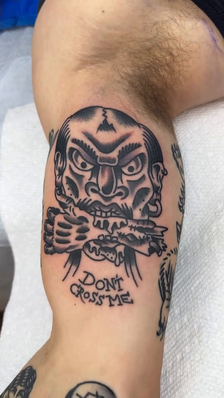 Demon face with snake American traditional tattoo by Keon Ostby, Tempe, Arizona