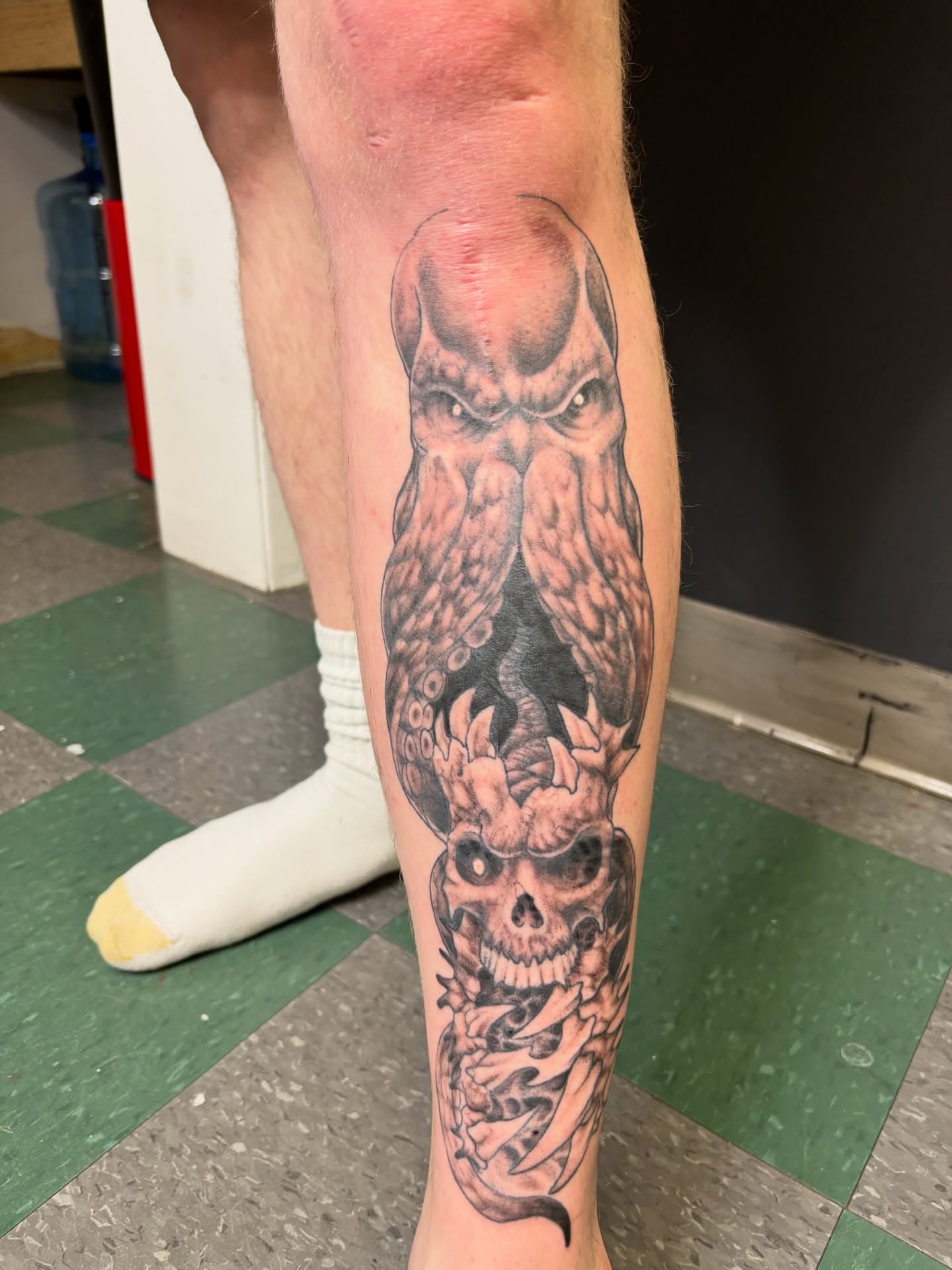 Skull and tentacle realism tattoo on the calf by Noah Blum