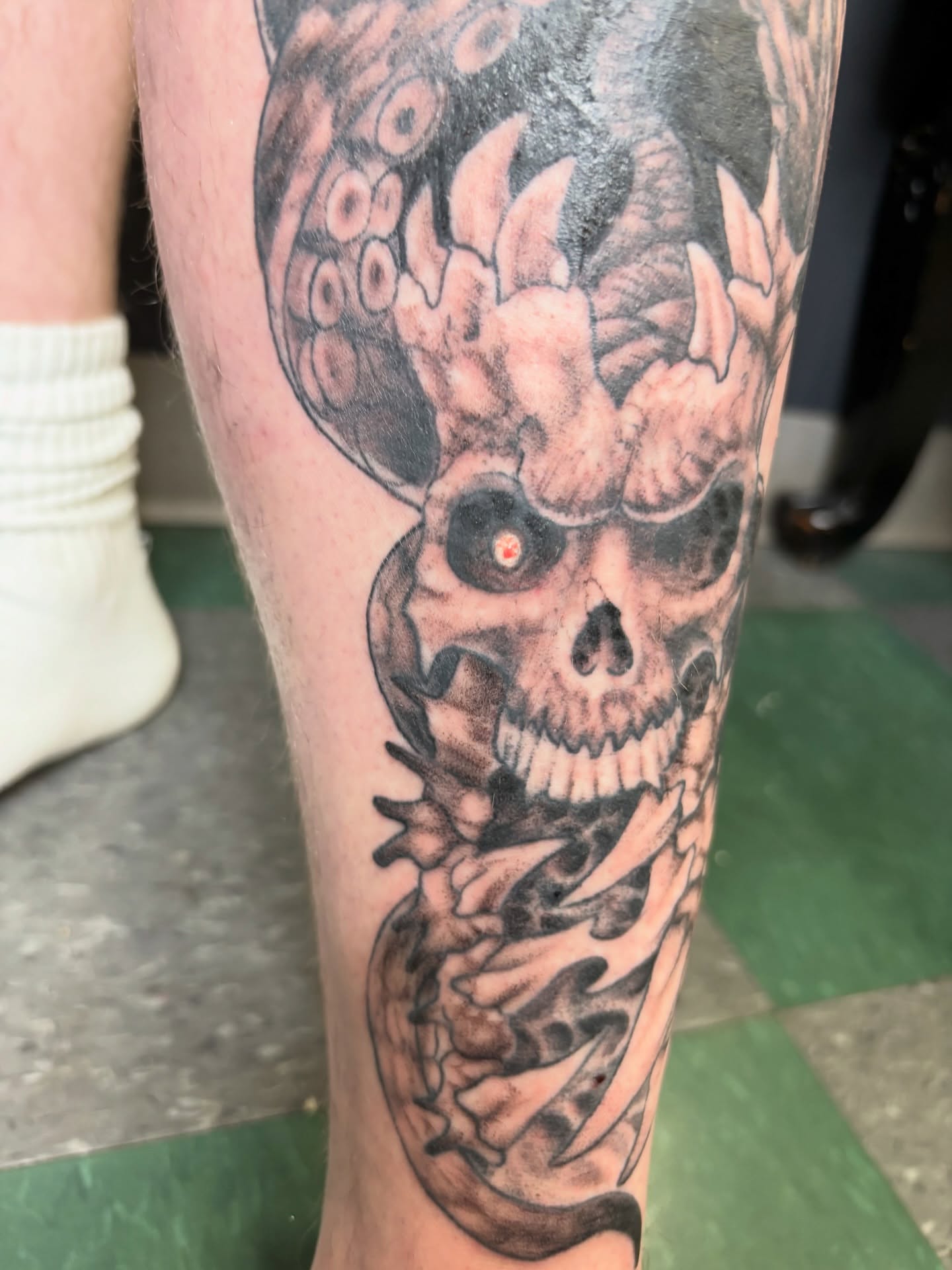Skull with tentacles dark realism tattoo on the forearm by Noah Blum