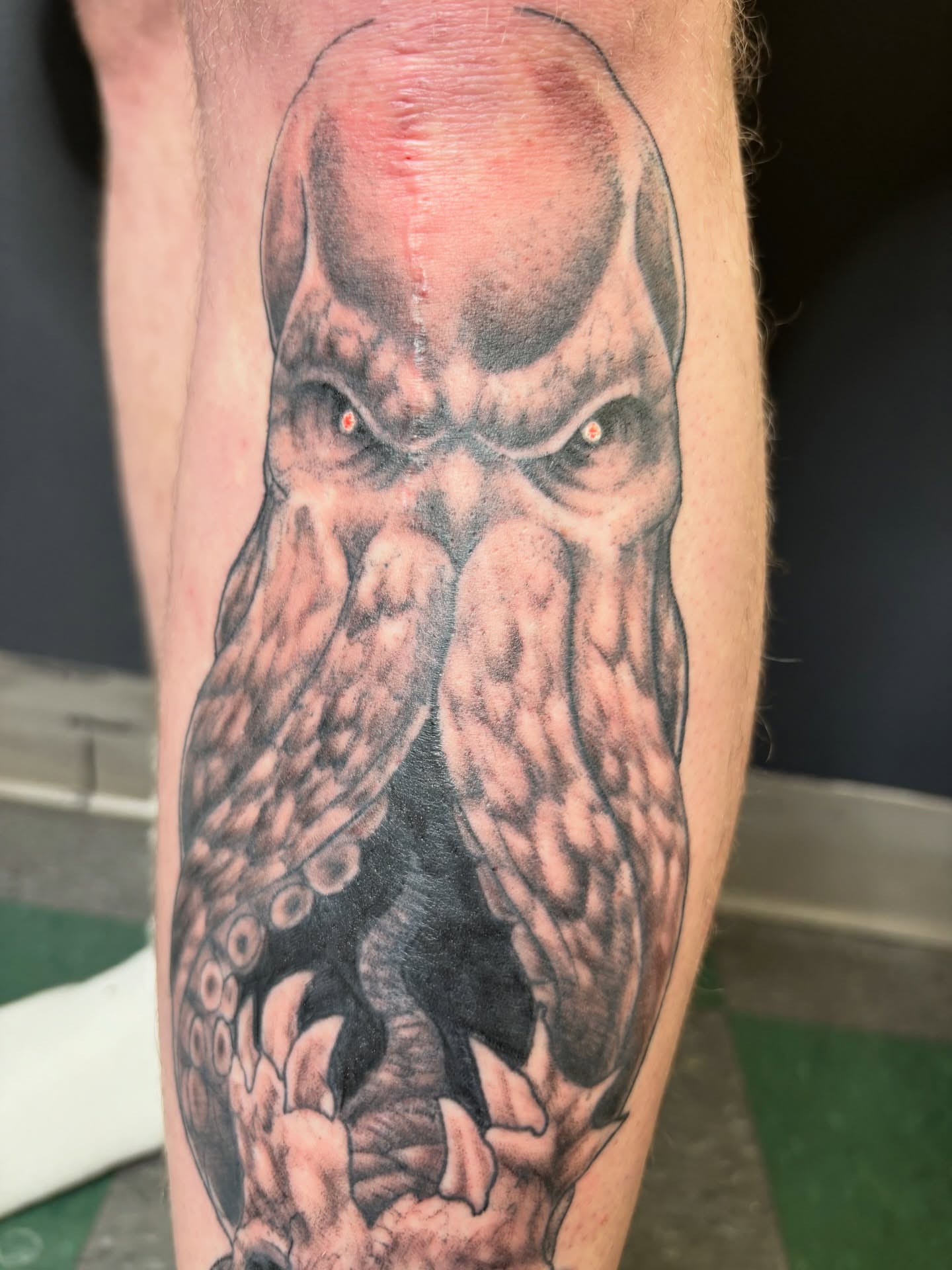 Octopus dark realism tattoo on the forearm by Noah Blum
