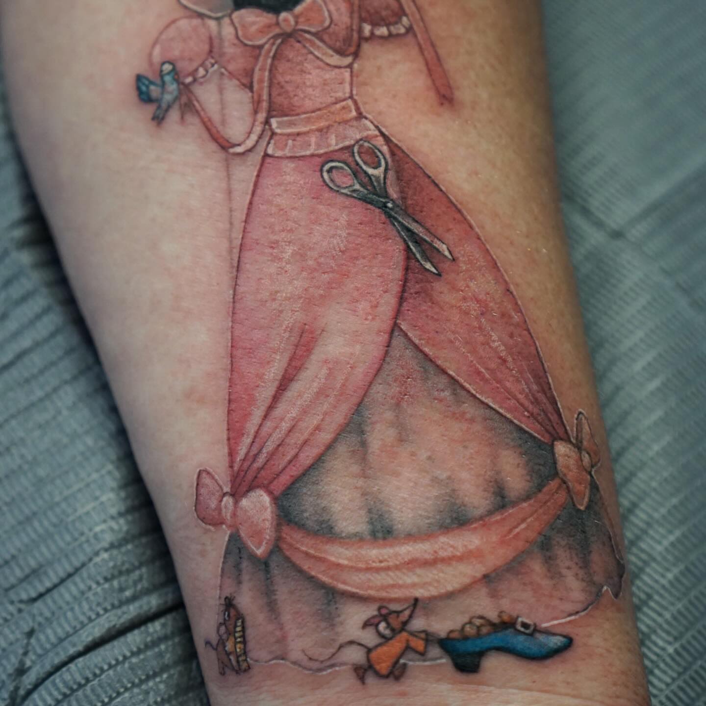 Dress and scissors illustrative tattoo on the forearm by Nicholas Capellan, Winter Park, Florida