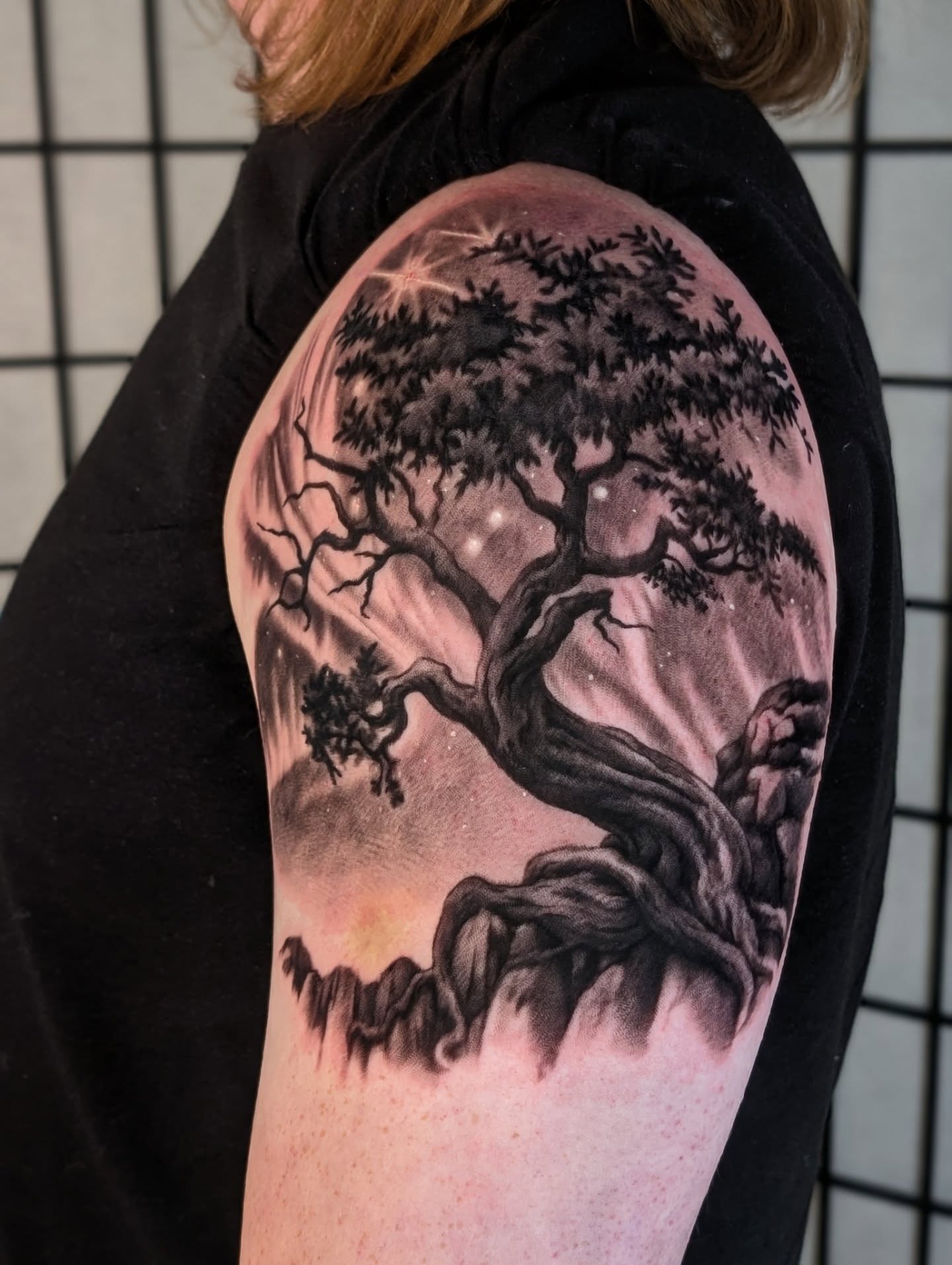 Tree realism tattoo on the upper arm by Sean Costello