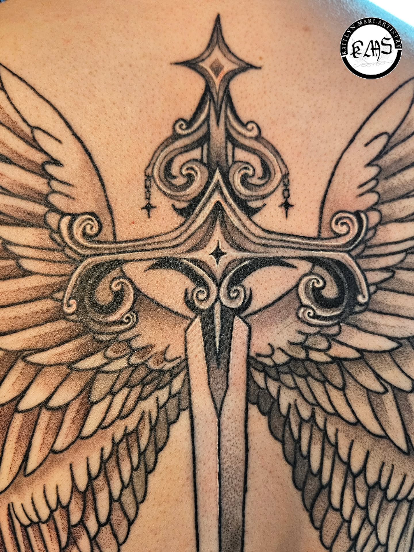 Cross with wings ornamental tattoo on the back by Kaitlyn Marianna Skewes 🌙 Illustrative