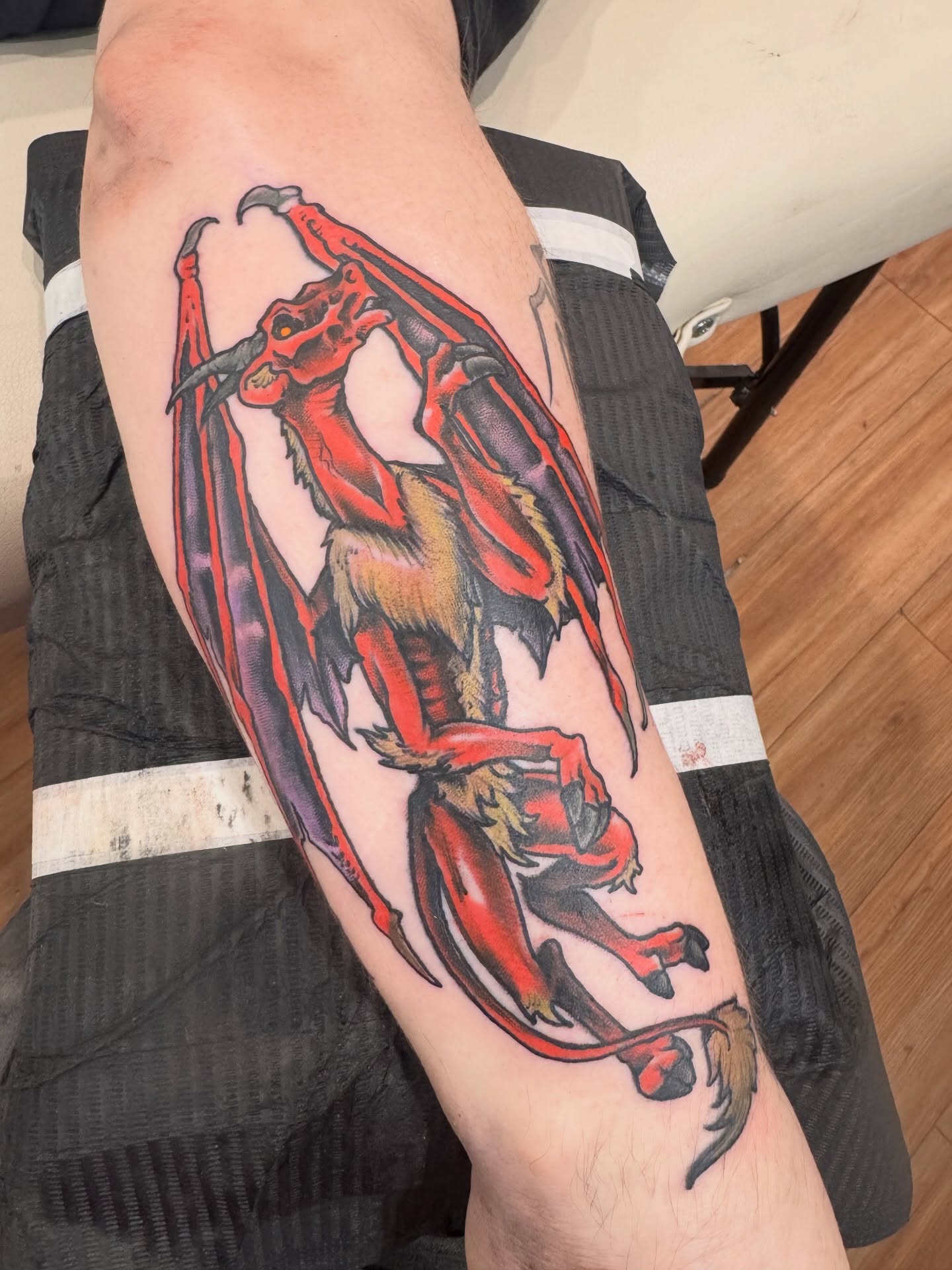 Red dragon realism tattoo on the forearm by Brian DiCola Tattooer